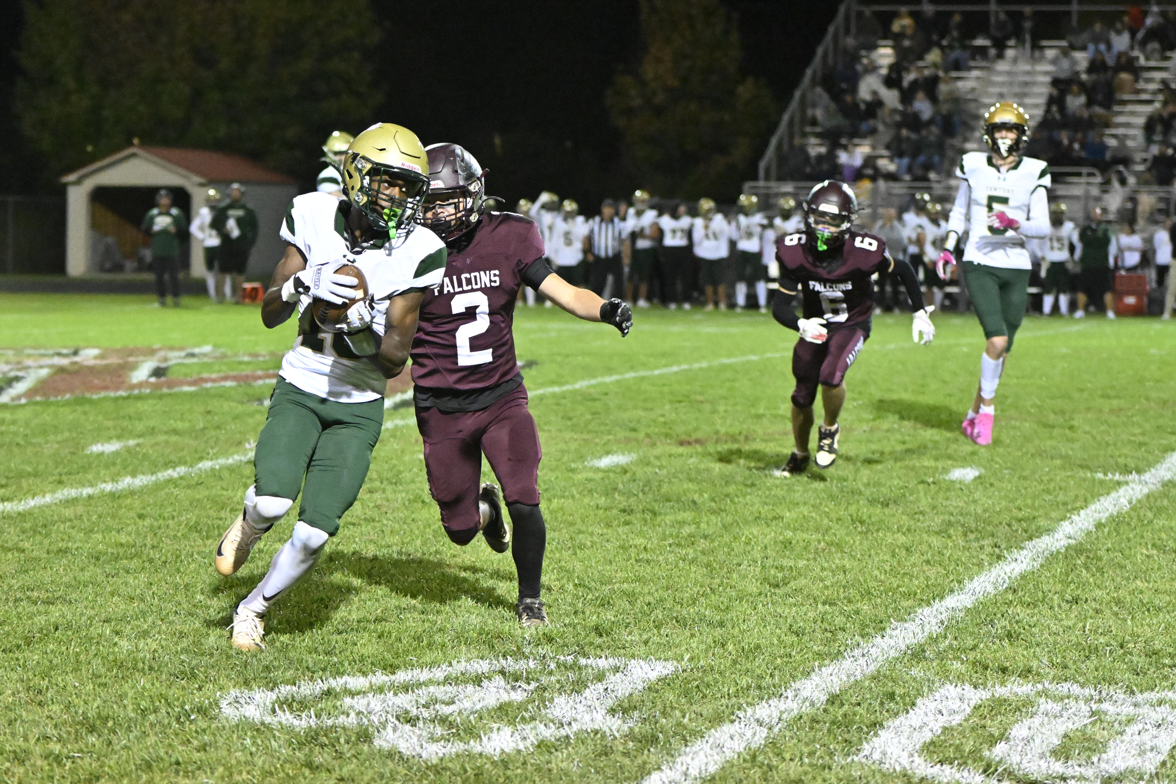 Century's Ethan Ashburne runs after reception as Ian Vasquez goes...