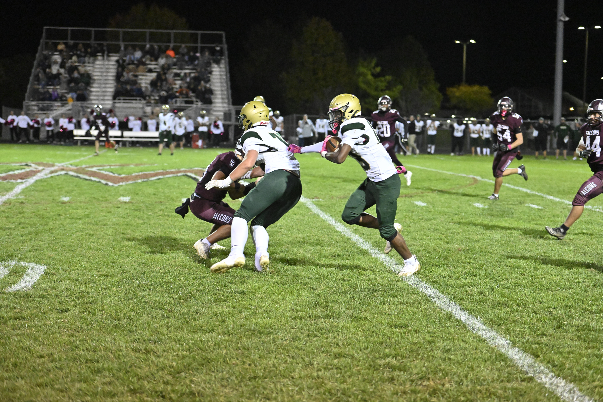 Century's Delon Barnes runs behind his blocker Jacob Plummer during...