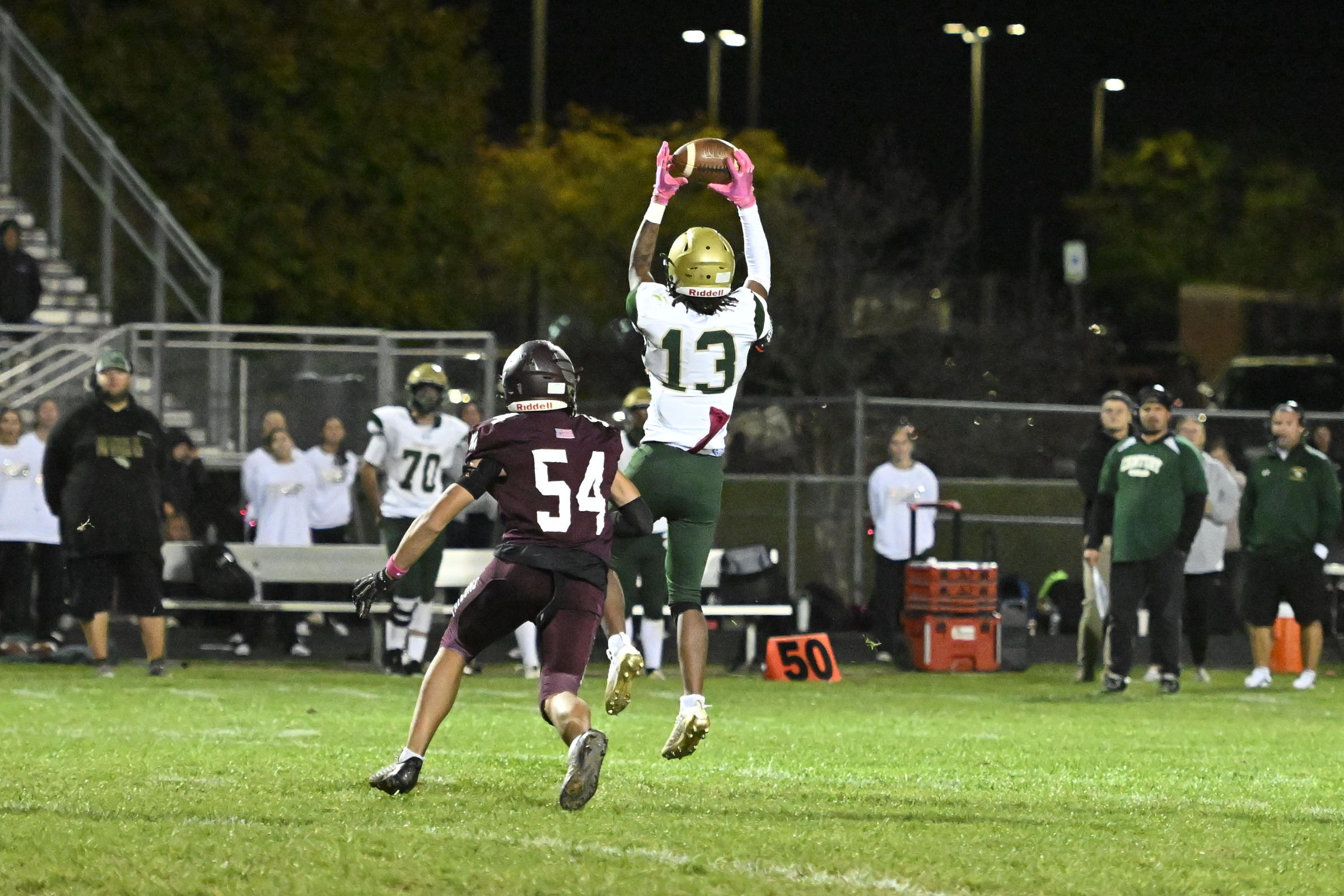 Century's Delon Barnes pulls down a pass during a football...