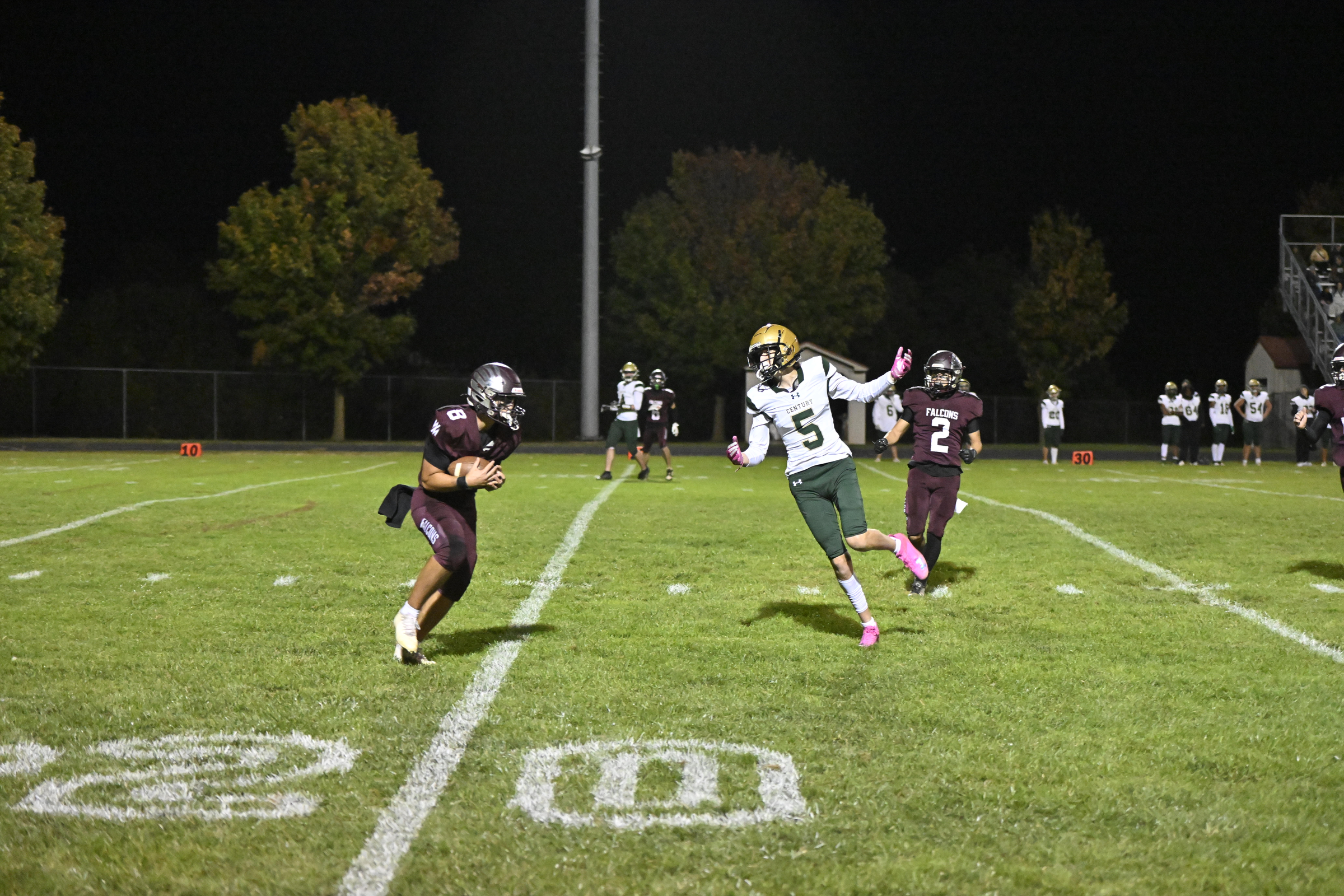 Austin Denning intercepts a Century pass during a football game...