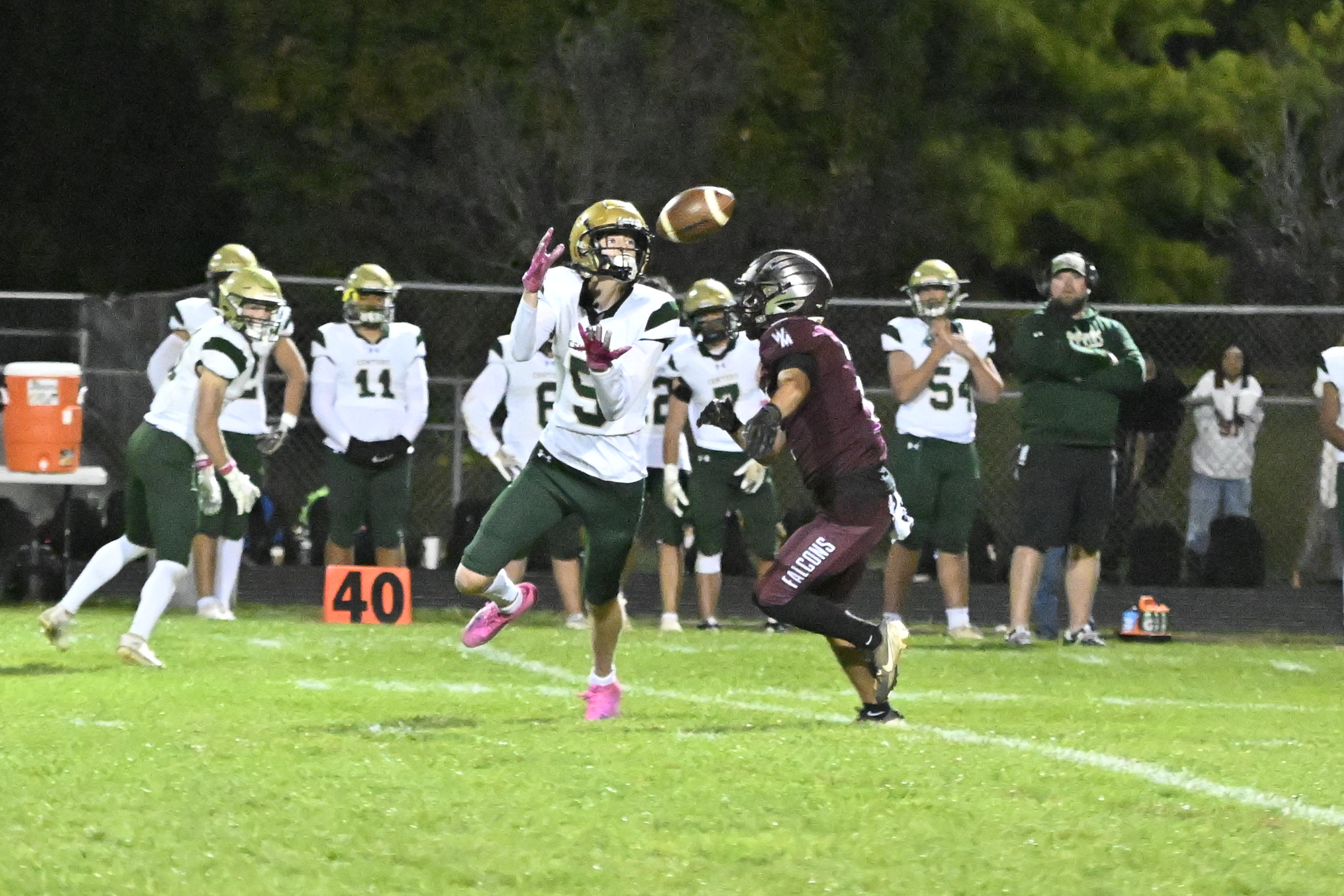 Century's Quentin Duncan makes a catch during a football game...
