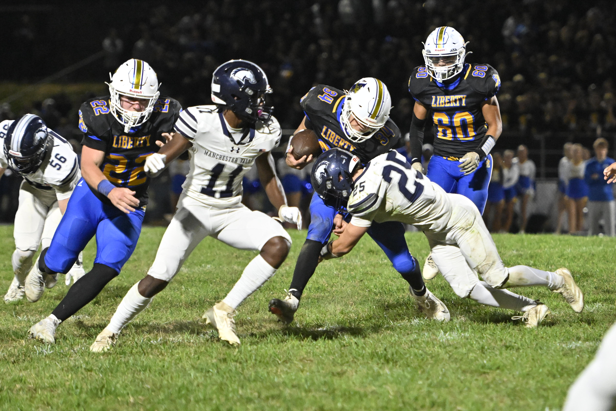 Andrew McGlynn is tackled by Manchester Valley's John Day during...