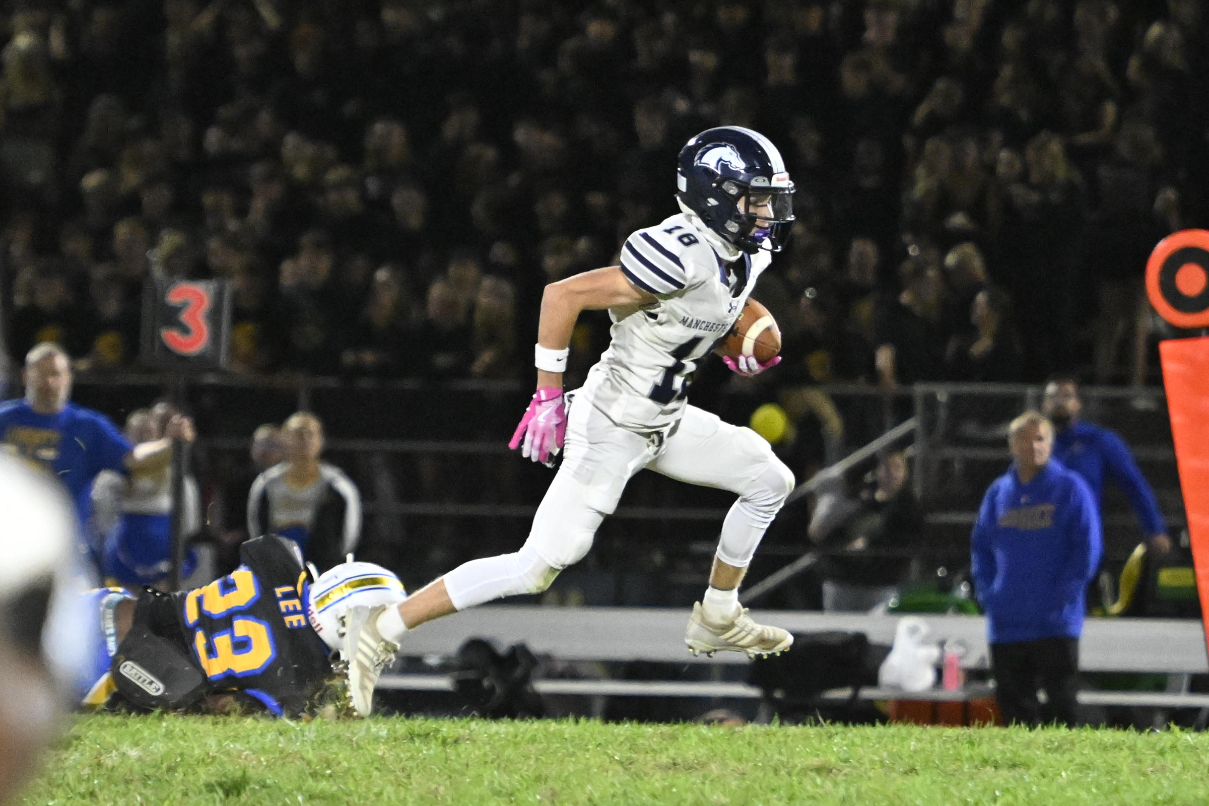 Manchester Valley's Nick Furano runs the ball during a football...