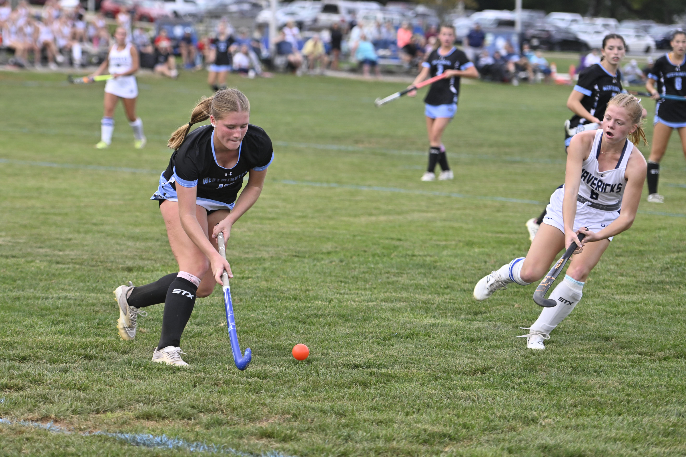 Reagan Duffy hits the ball during a field hockey game...