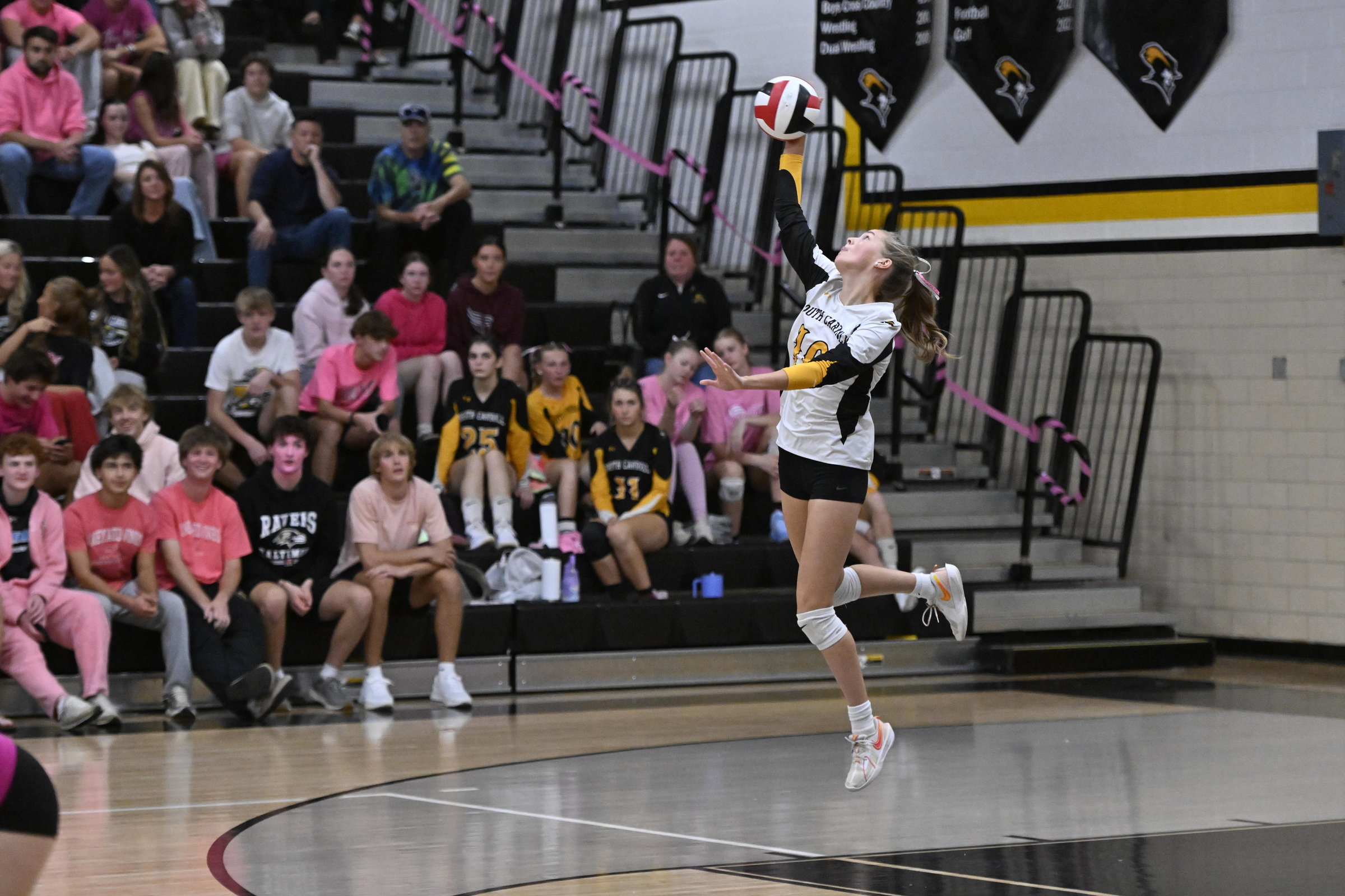 Kylie Rogers serves during a volleyball game at South Carroll...