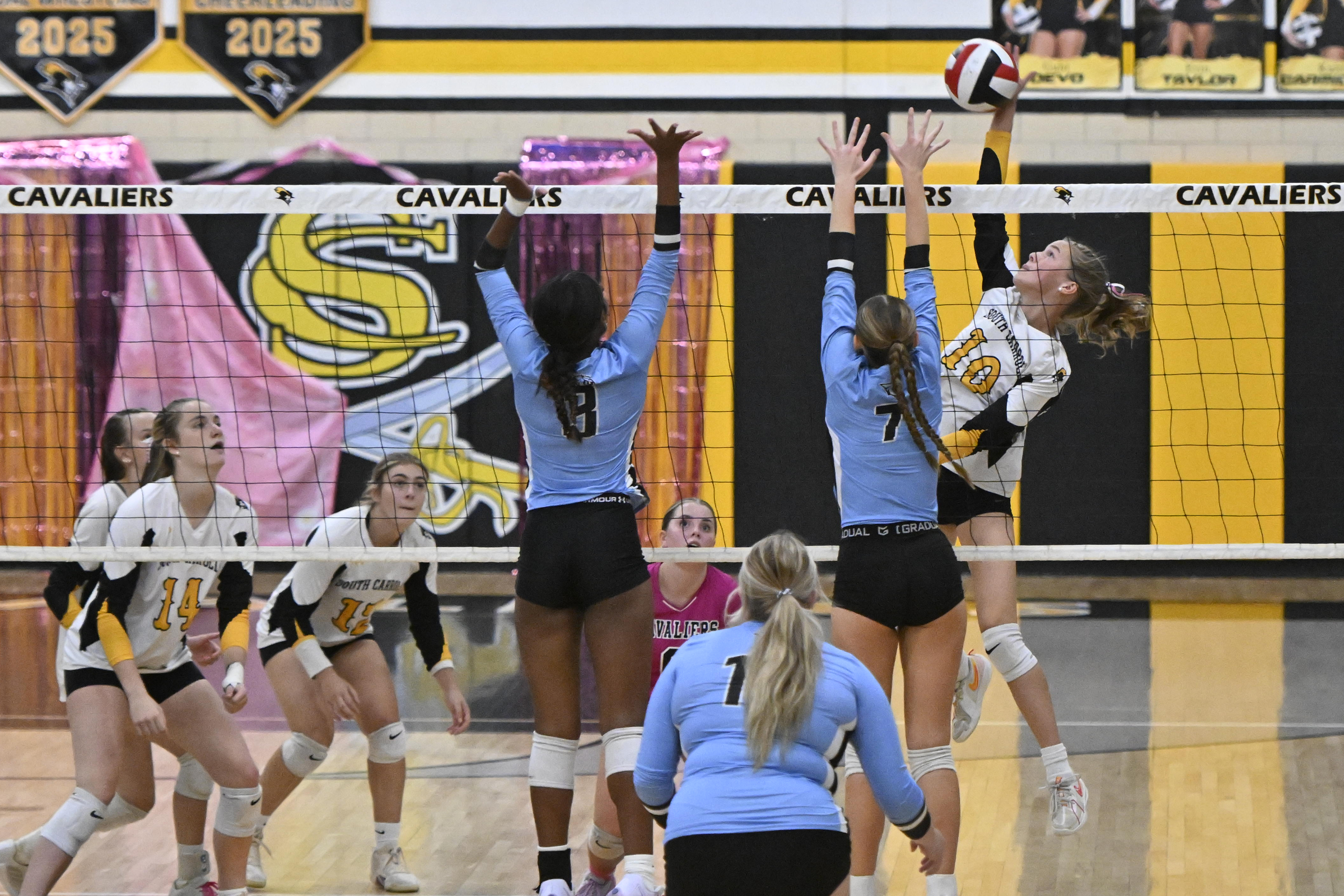 Kylie Rogers spikes the ball during a volleyball game at...