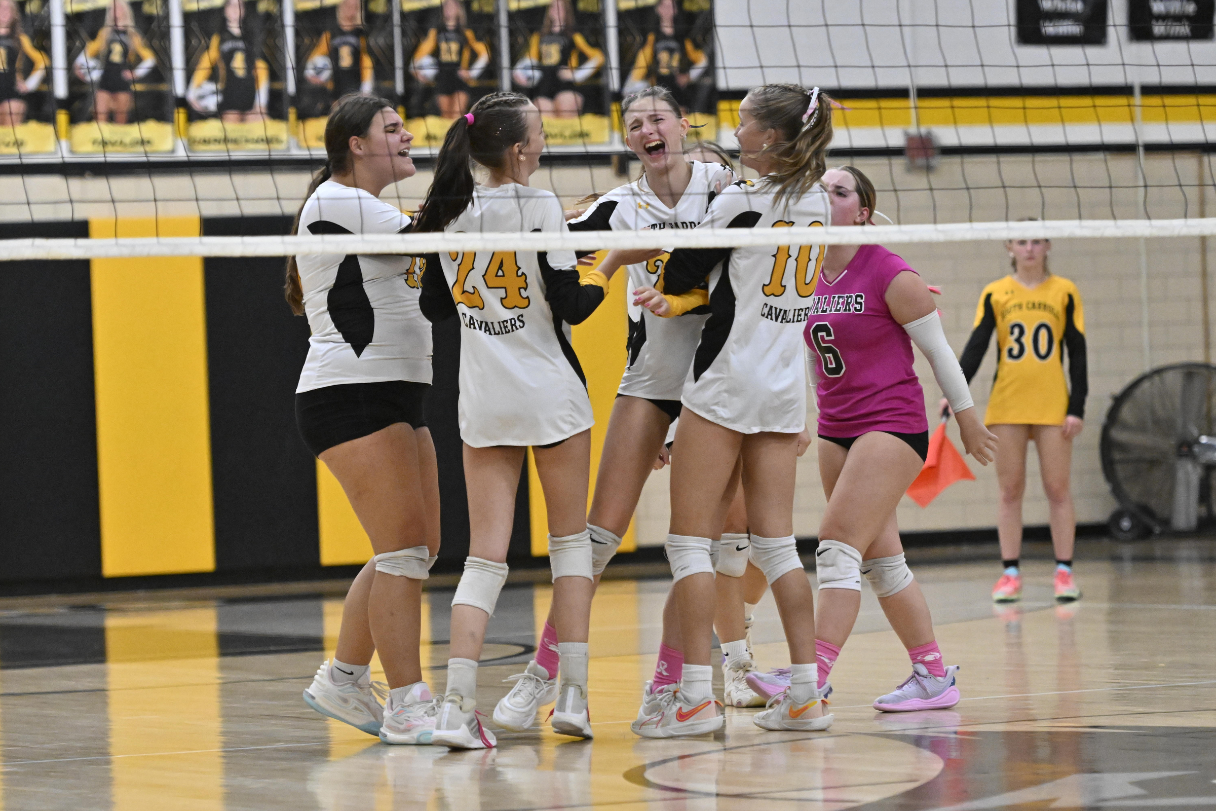 South Carroll celebrates winning a point during a volleyball game...