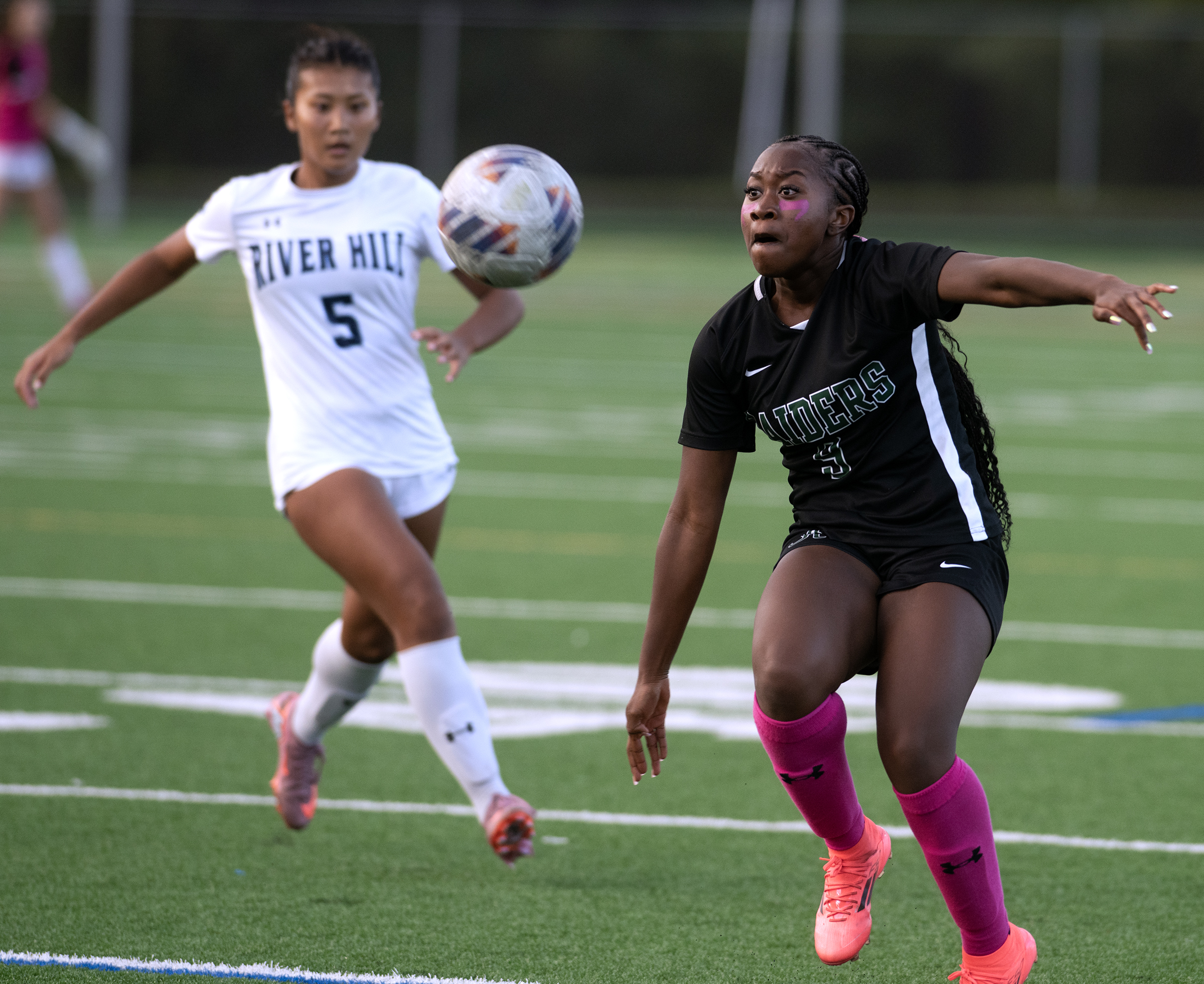 Oct. 14, 2025- Atholton's Denive Guy-Williams, right, watches the ball...