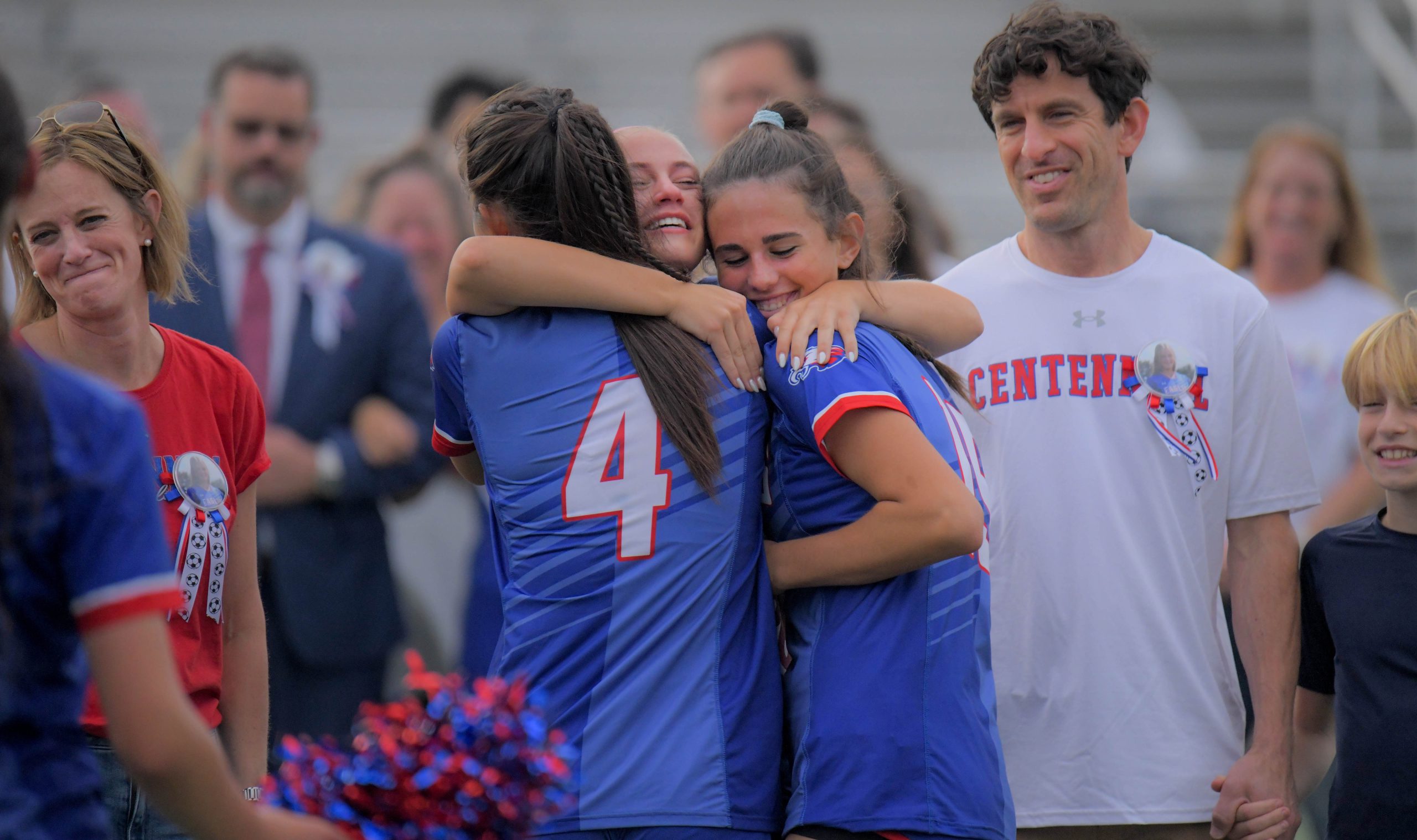 With family watching, Centennial Eagles midfielder Claire Adams, facing camera...