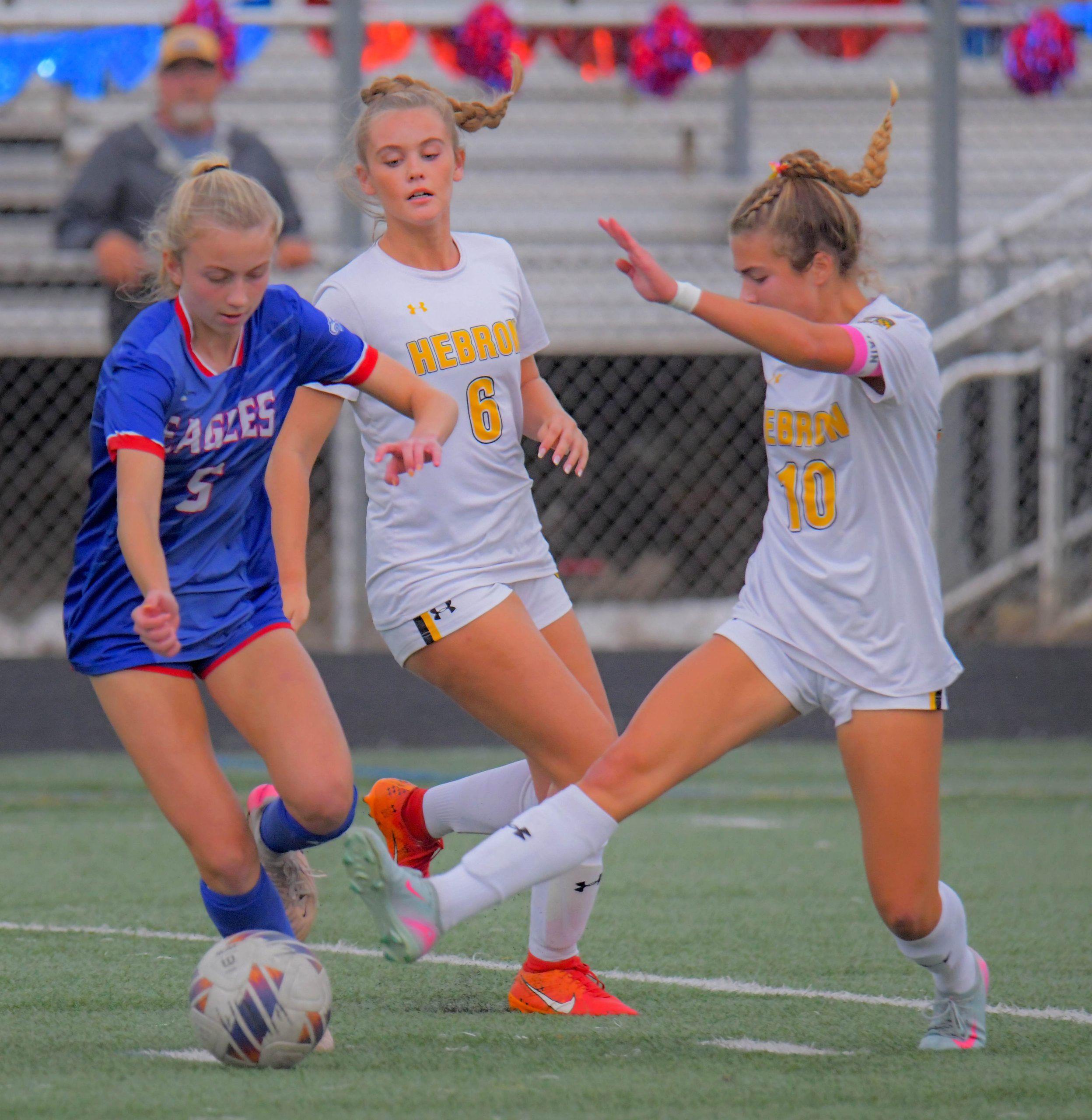 Mt. Hebron midfielder Grace Garvin, right, moves to knock the...