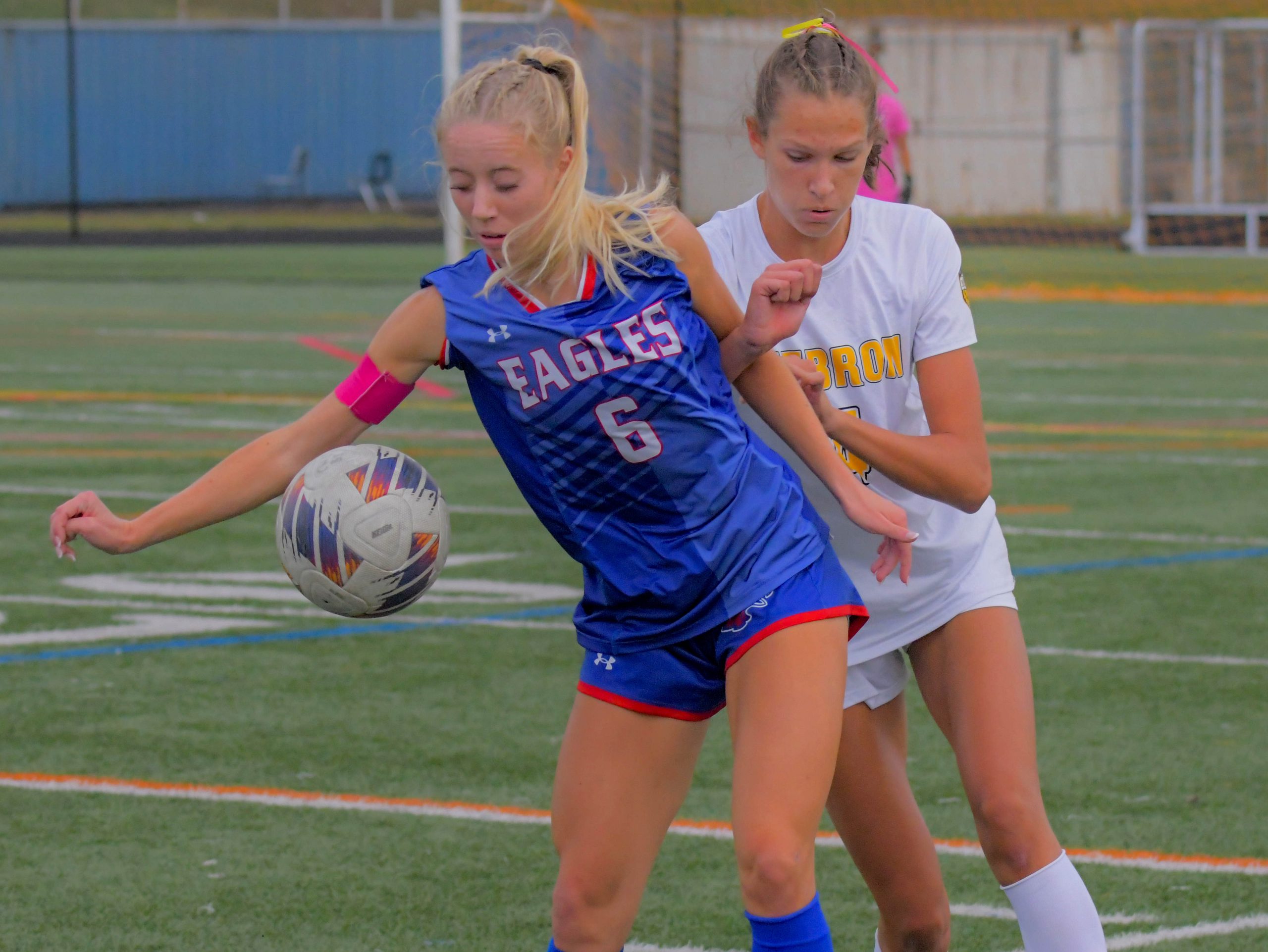 The ball bounces off Centennial Eagles striker/midfielder Abby Desena while...
