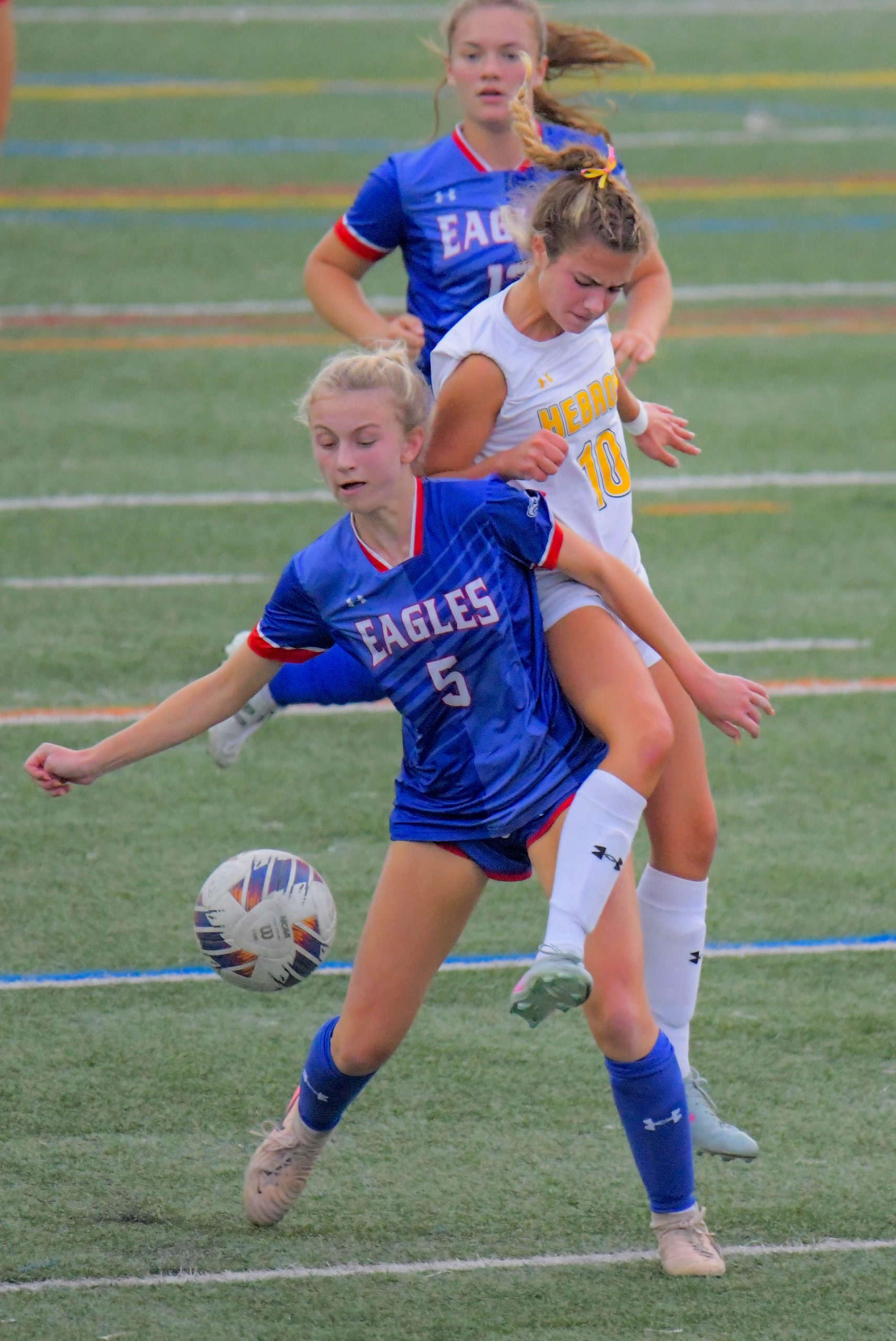 Mount Hebron Vikings midfielder Iris Vainieri hits Centennial Eagles defender...