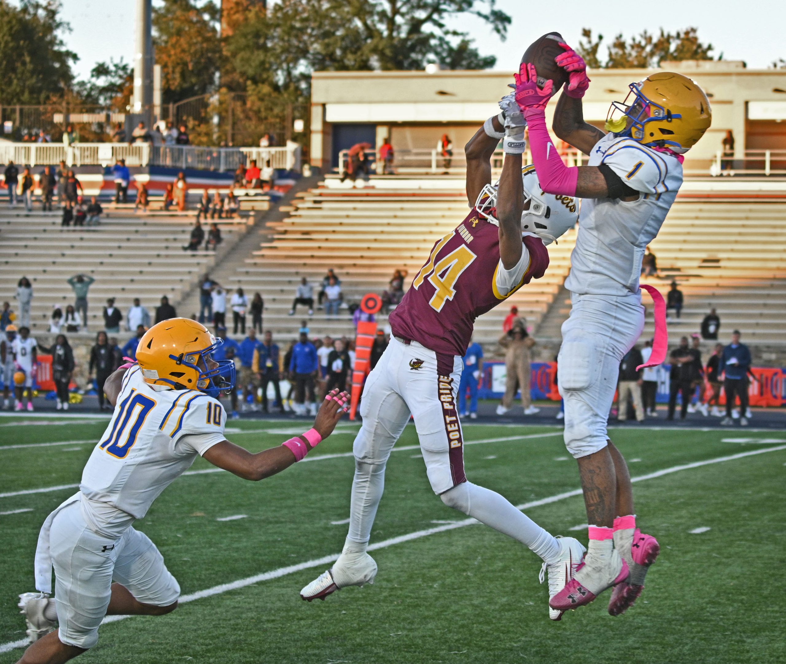 Mervo’s Tywan Baker, right, intercepts a pass intended for Dunbar’s...