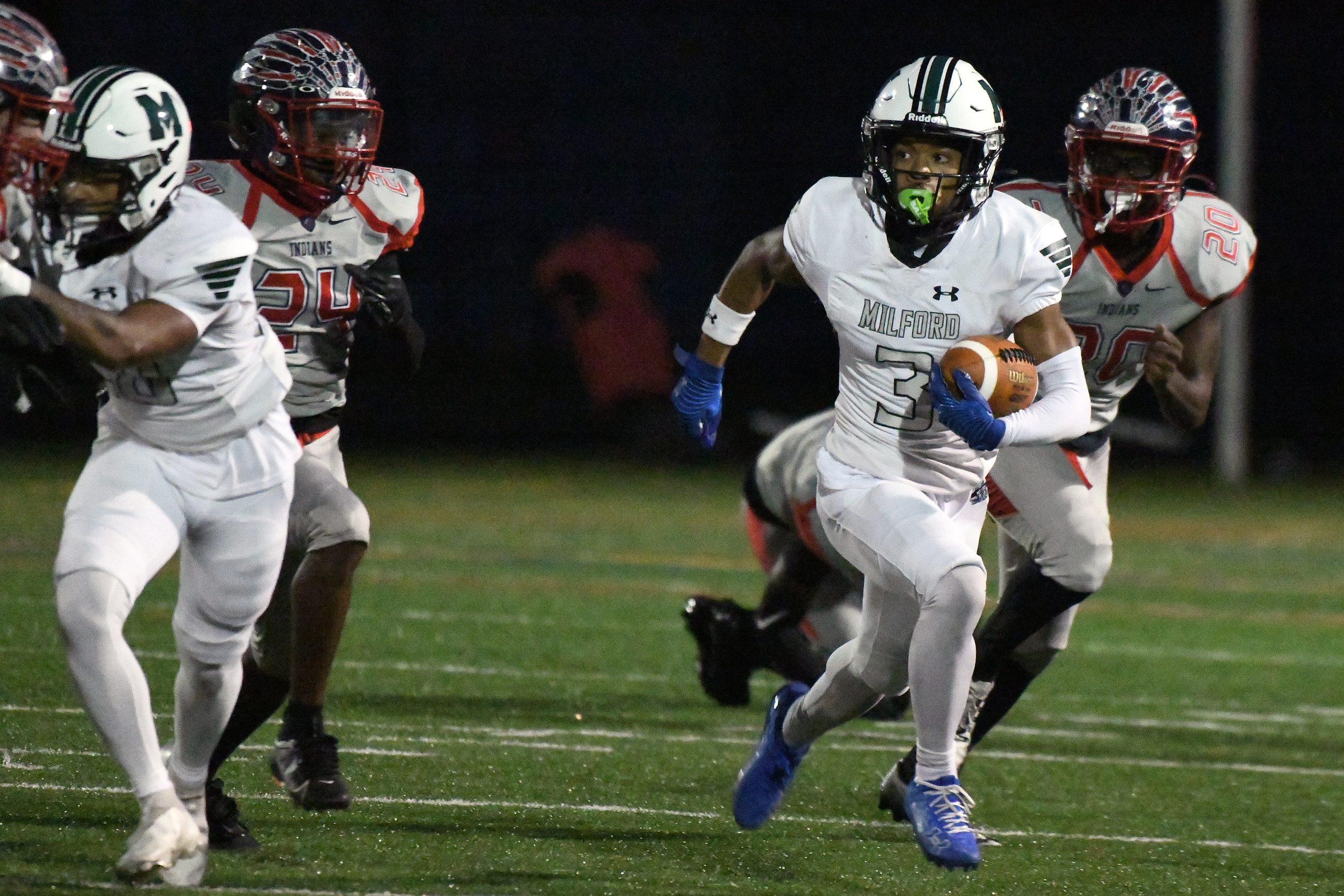 Amauri Patterson, Milford Mill, runs the ball in the first...