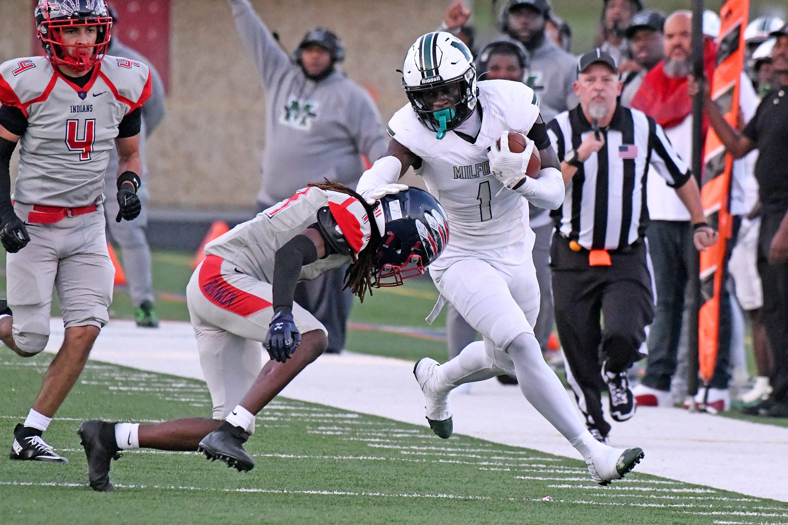 Franklin's Christopher Crawford pushes Milford Mill's Koby Sarkodie out of...