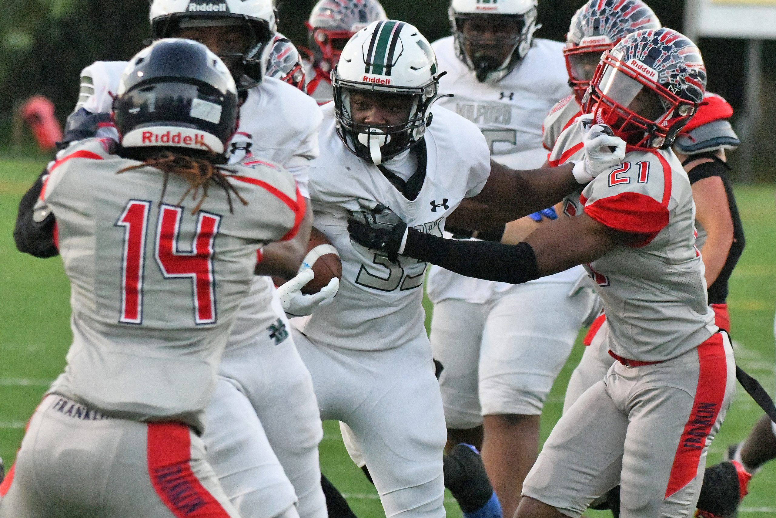 Center, De’Onte Ross, Milford Mill, carries the ball as he...