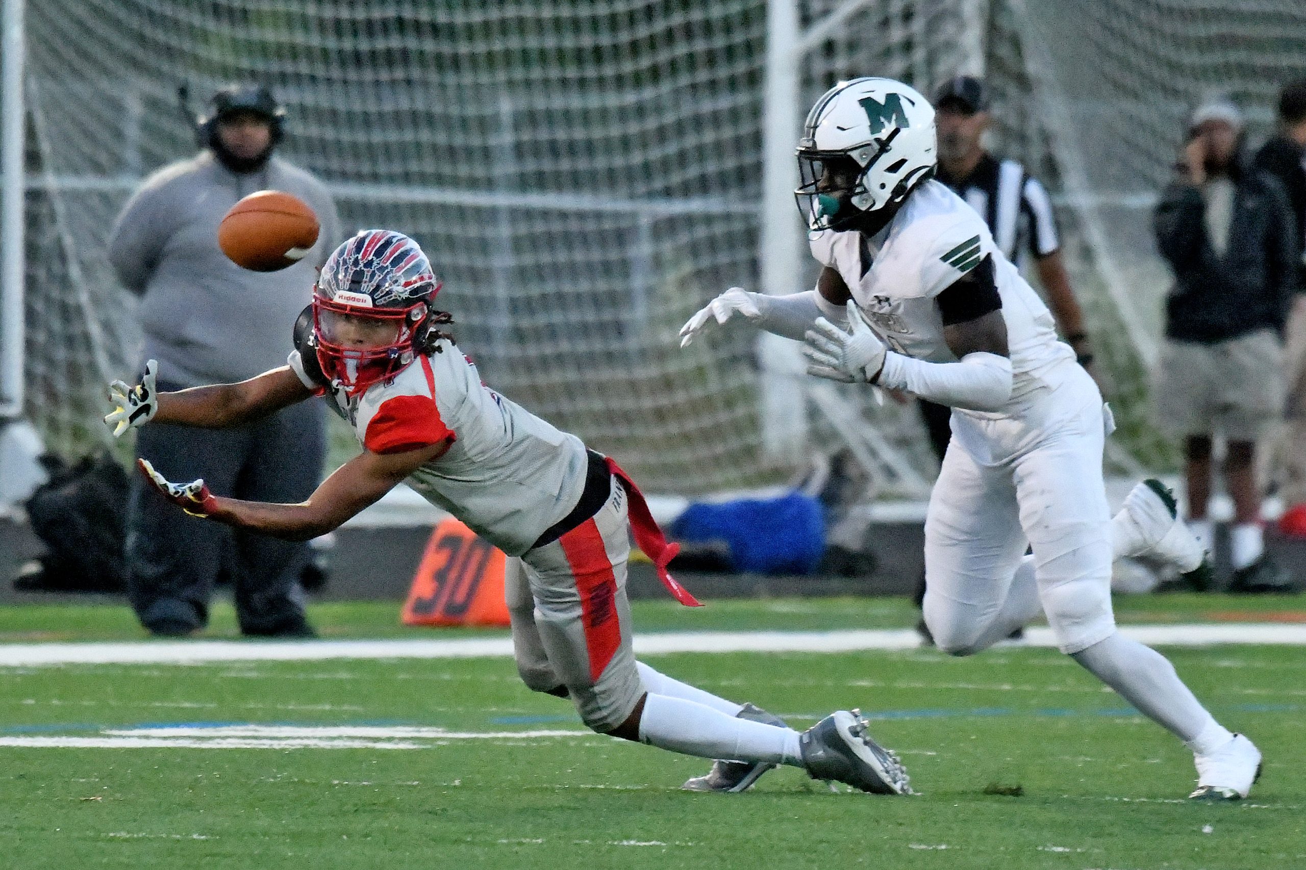 Jayen Newman, Franklin, is unsuccessful catching a pass as he...