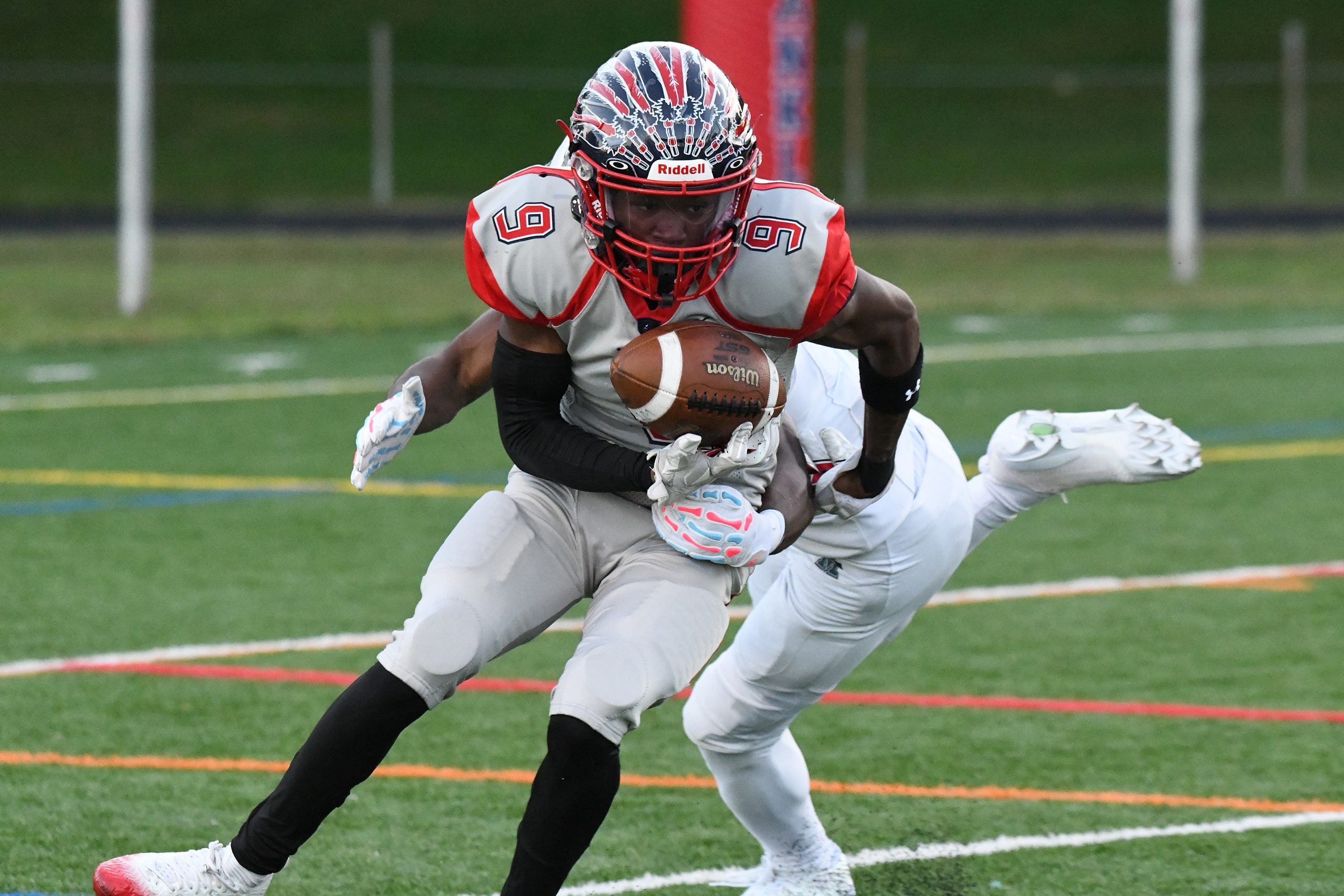 Korbin Gilbert, Franklin, is held up by a Milford Mill...