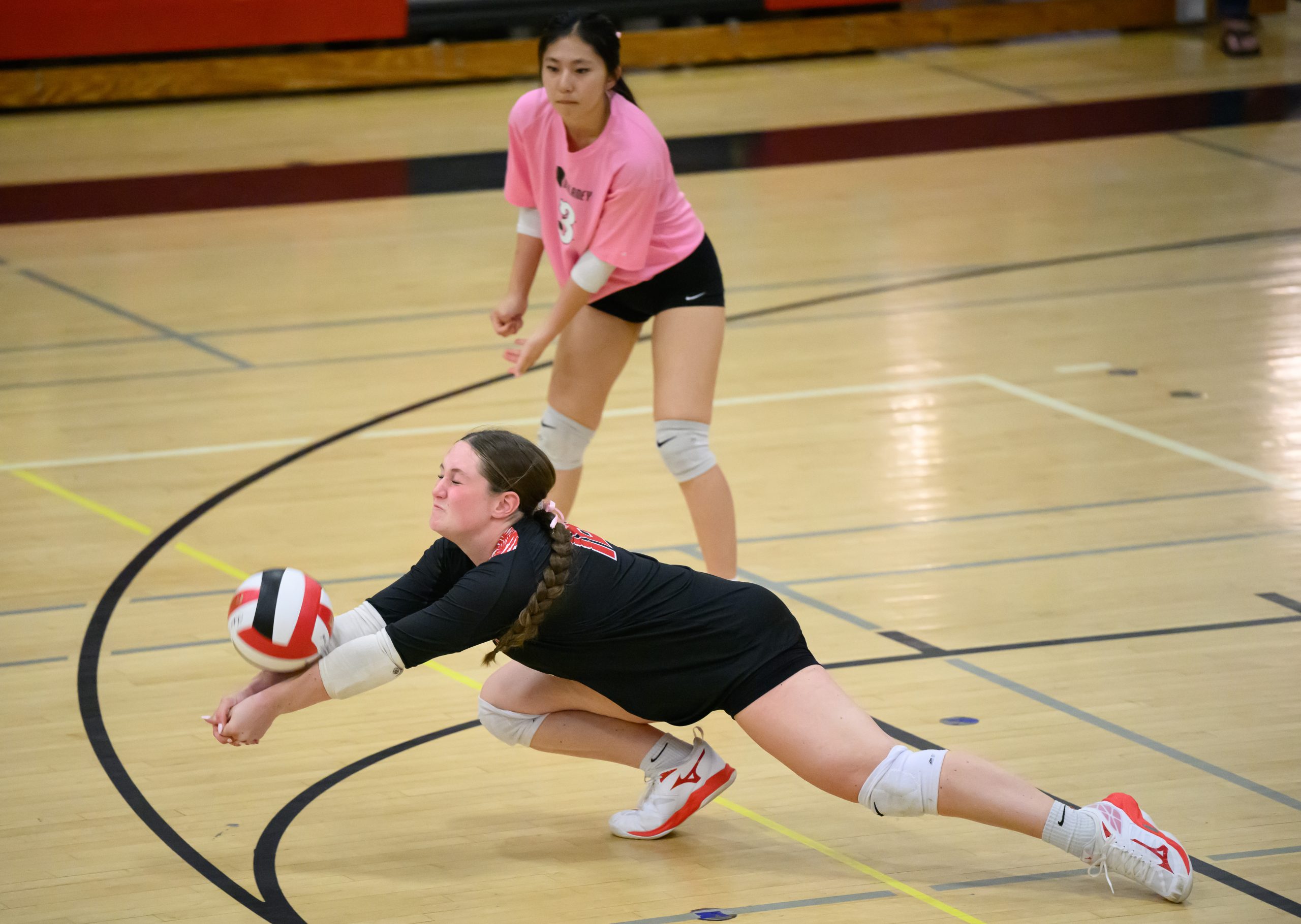 Dulaney’s Carley Desi, #18, lunges for a dig against Hereford...