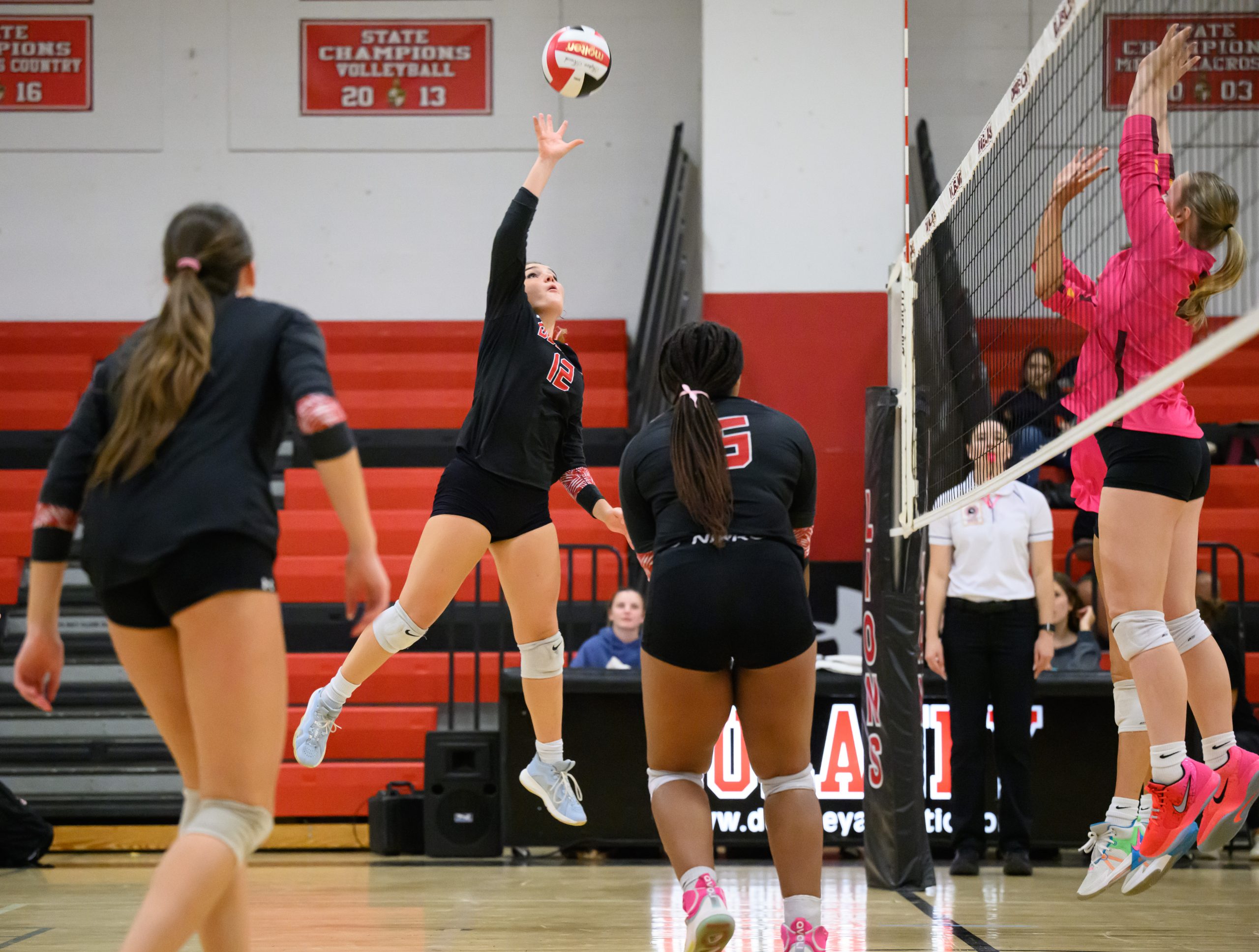 Dulaney’s Ellie Leone hits the ball against Hereford during a...