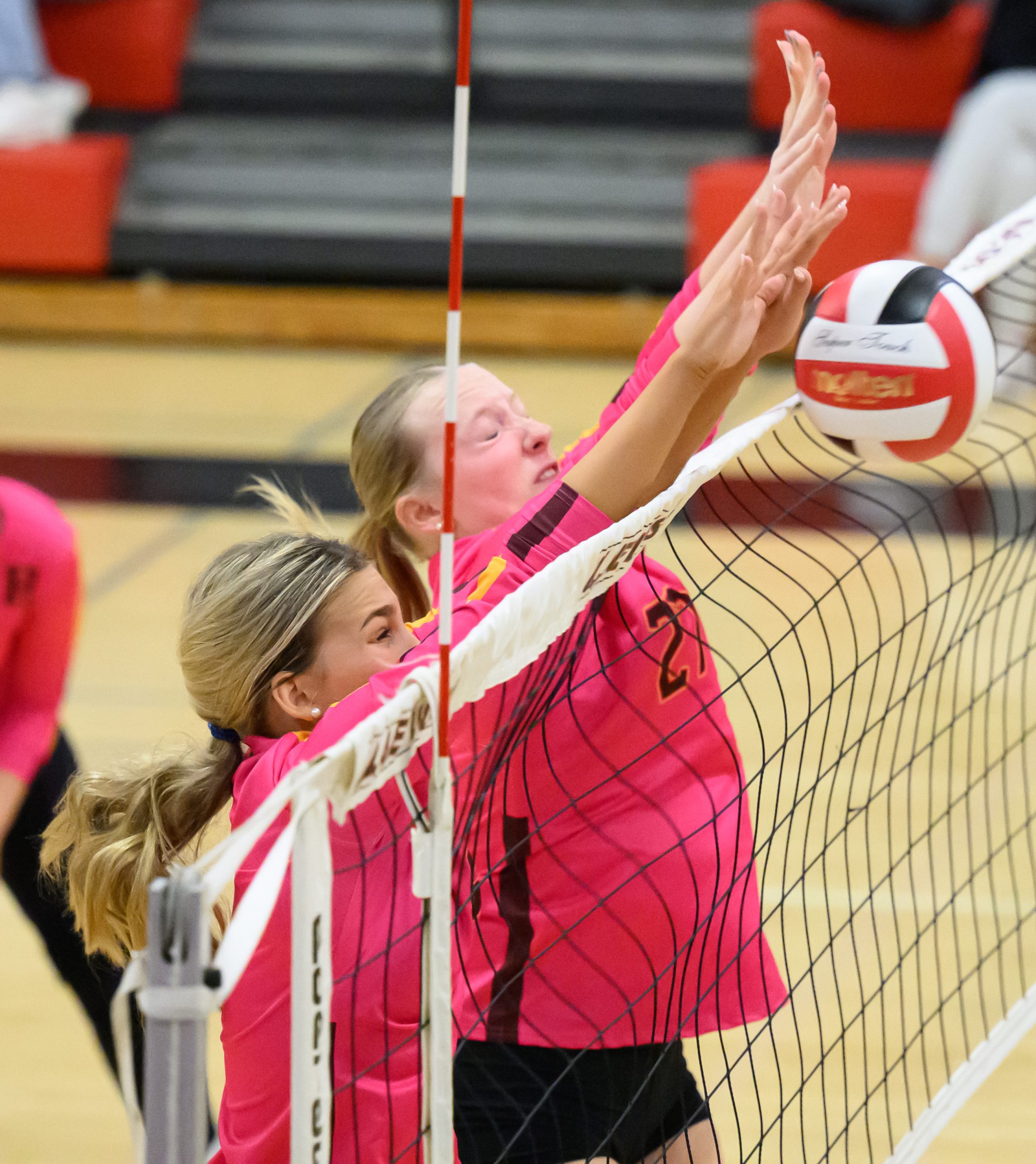 Hereford’s Soph Kefi, left, and Maddie Cavey jump for a...