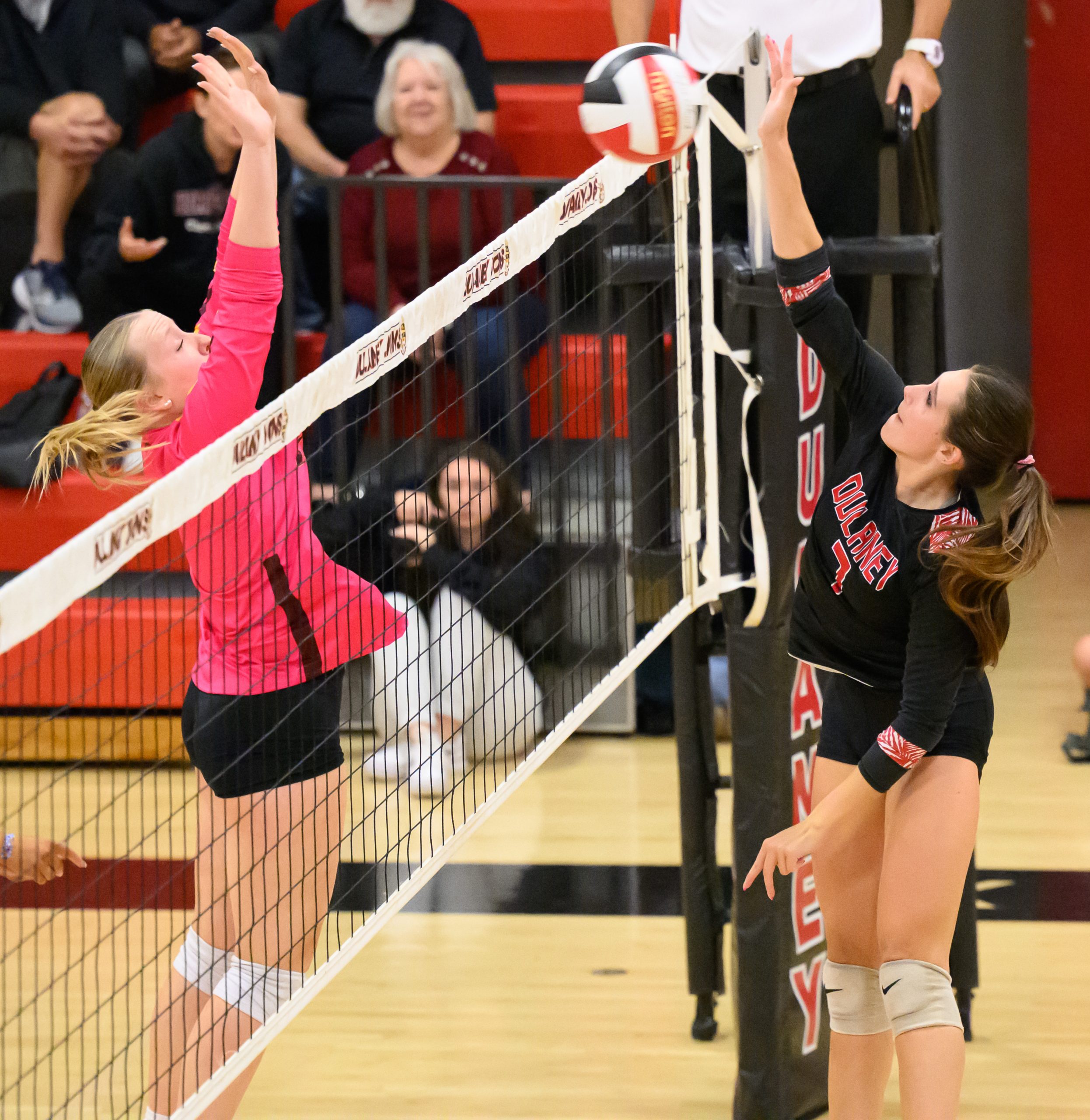 Dulaney’s Serafina Reckamp, right, hits a ball against Hereford’s Maddie...
