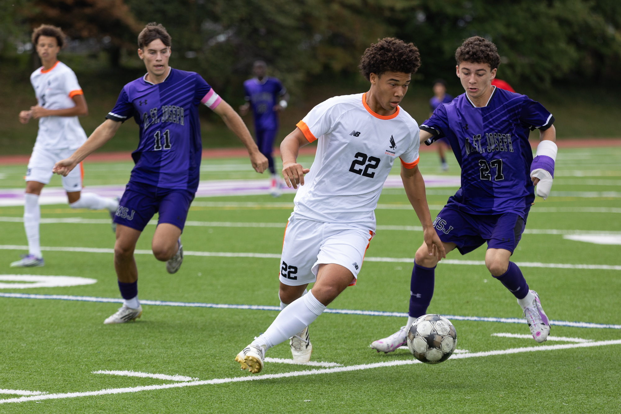 McDonogh’s William Ashley fends off Nicholas Reed during the game...
