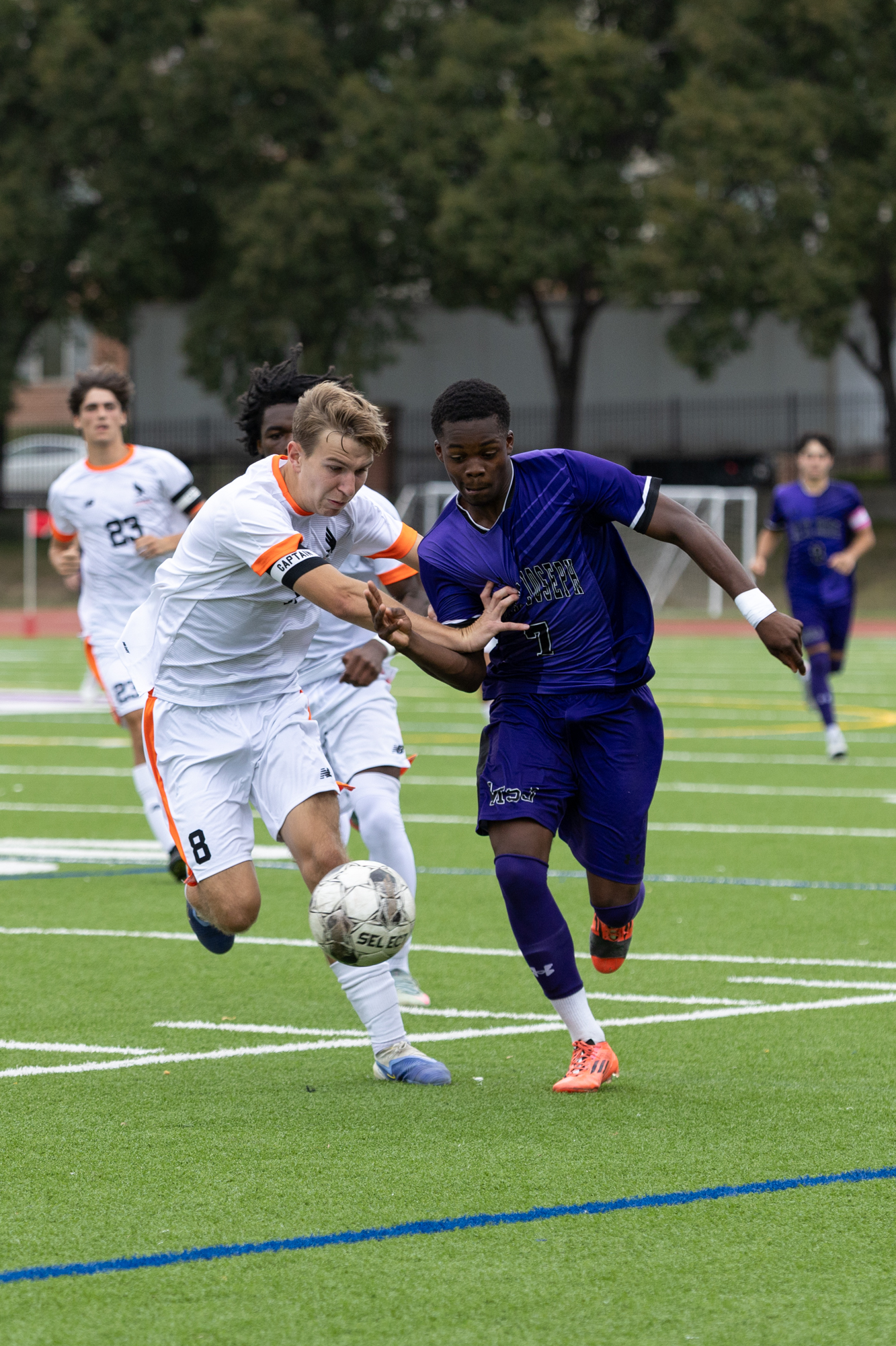 Mount Saint Joseph’s Immanuel Duodu and Maddox Ward compete for...