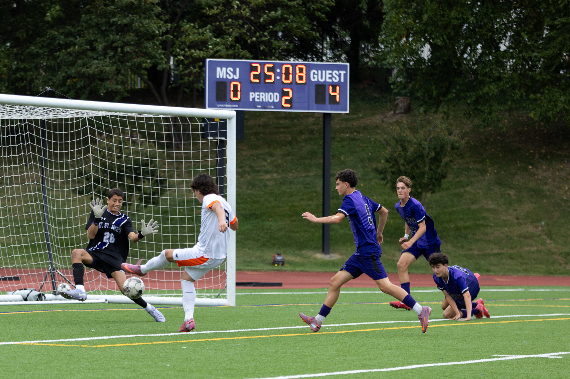 Mount Saint Joseph goalkeeper Cohen Alexander makes a late save...