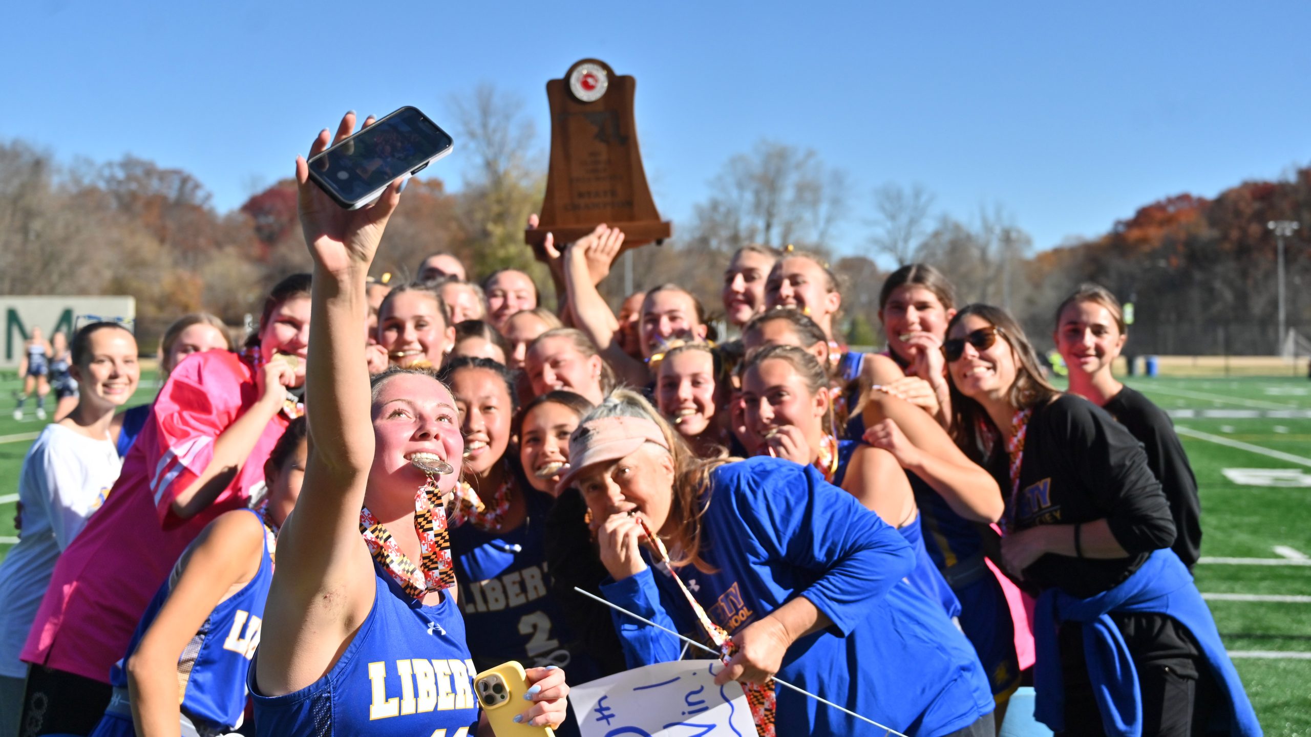 Liberty's Toi Schmitz takes a selfie with the team as...