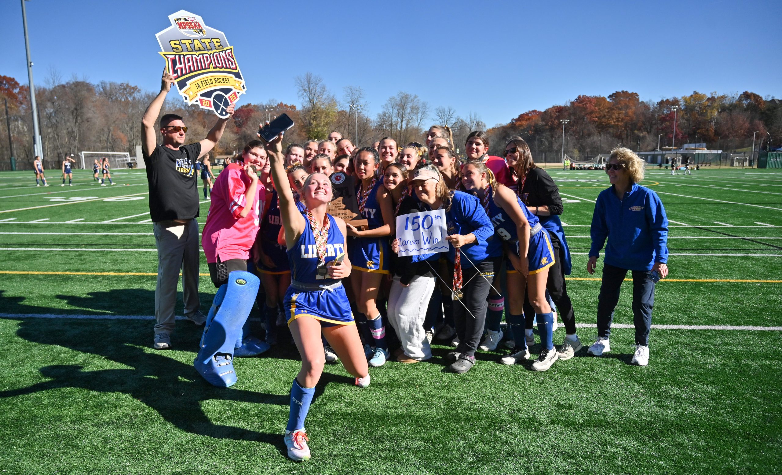 Liberty's Toi Schmitz takes a selfie with the team as...