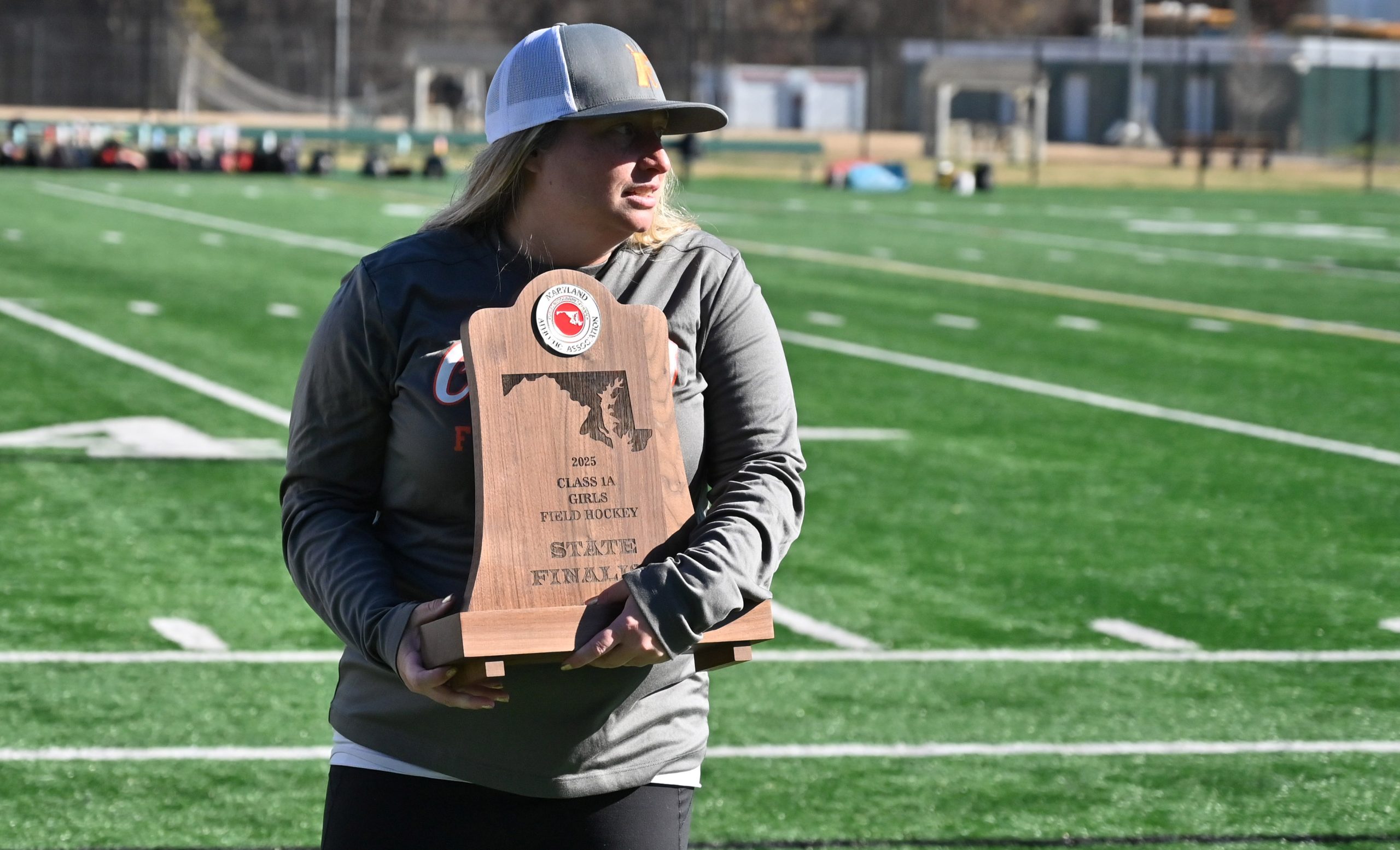 Fallston head coach Jackie Cummings accepts the finalist trophy following...