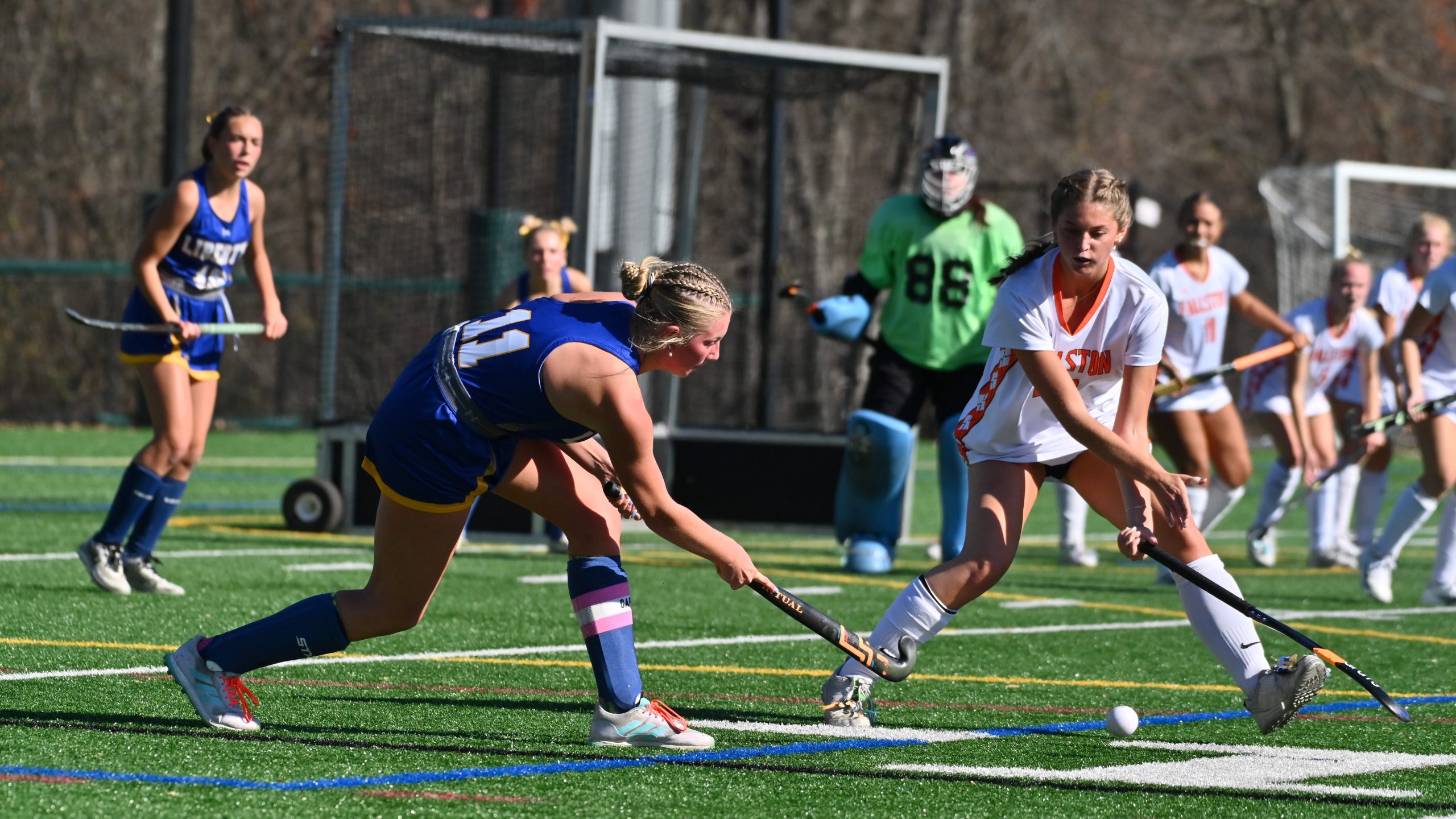 Liberty's Toi Schmitz, left, looks to pass the ball away...