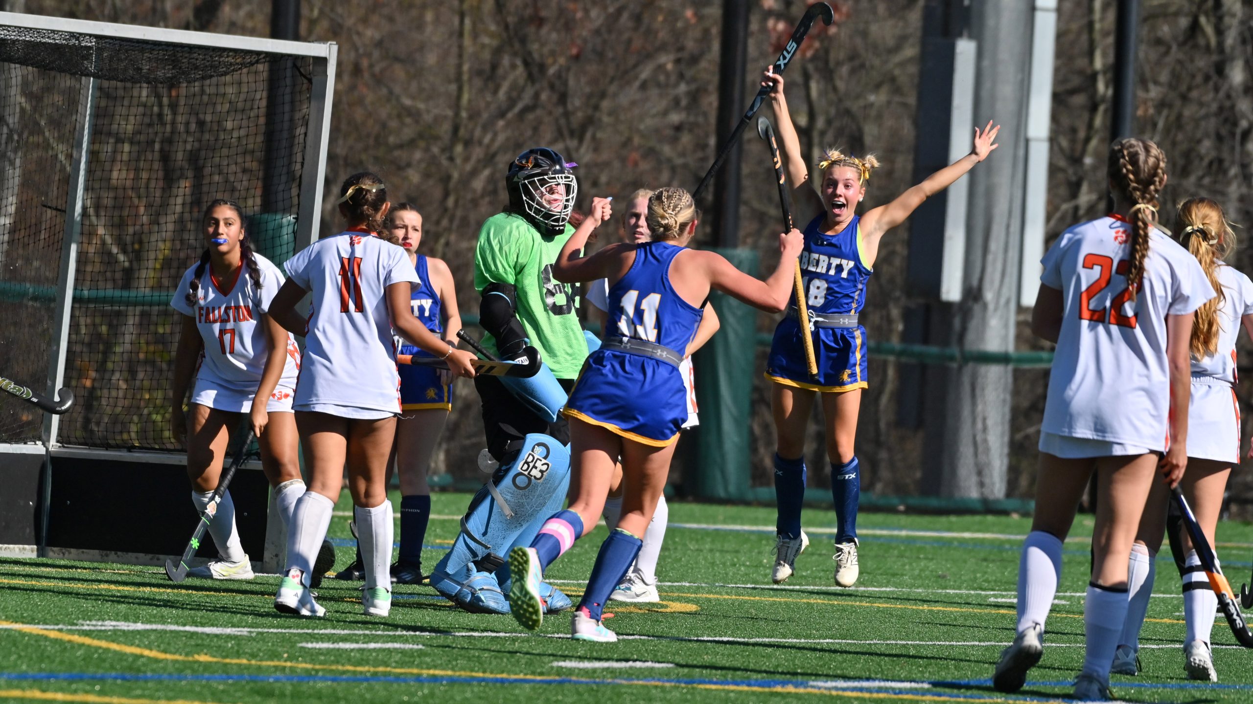 Liberty's Lacey Odachowski, celebrates scoring one of her three goals...