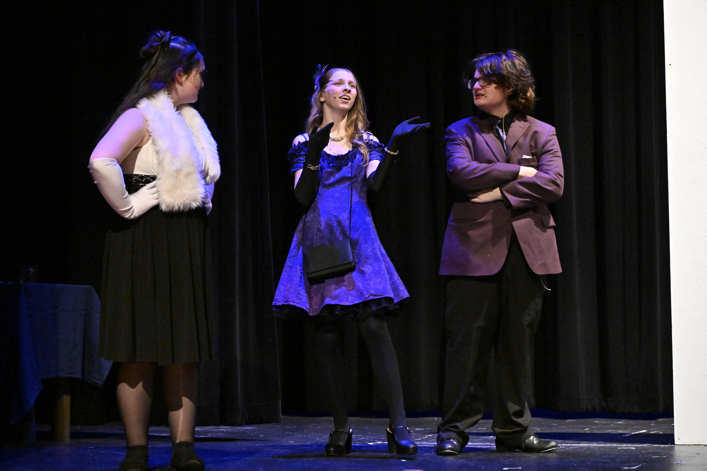 Mrs. Peacock, played by Maggie Beahm, center, speaks to Mrs....