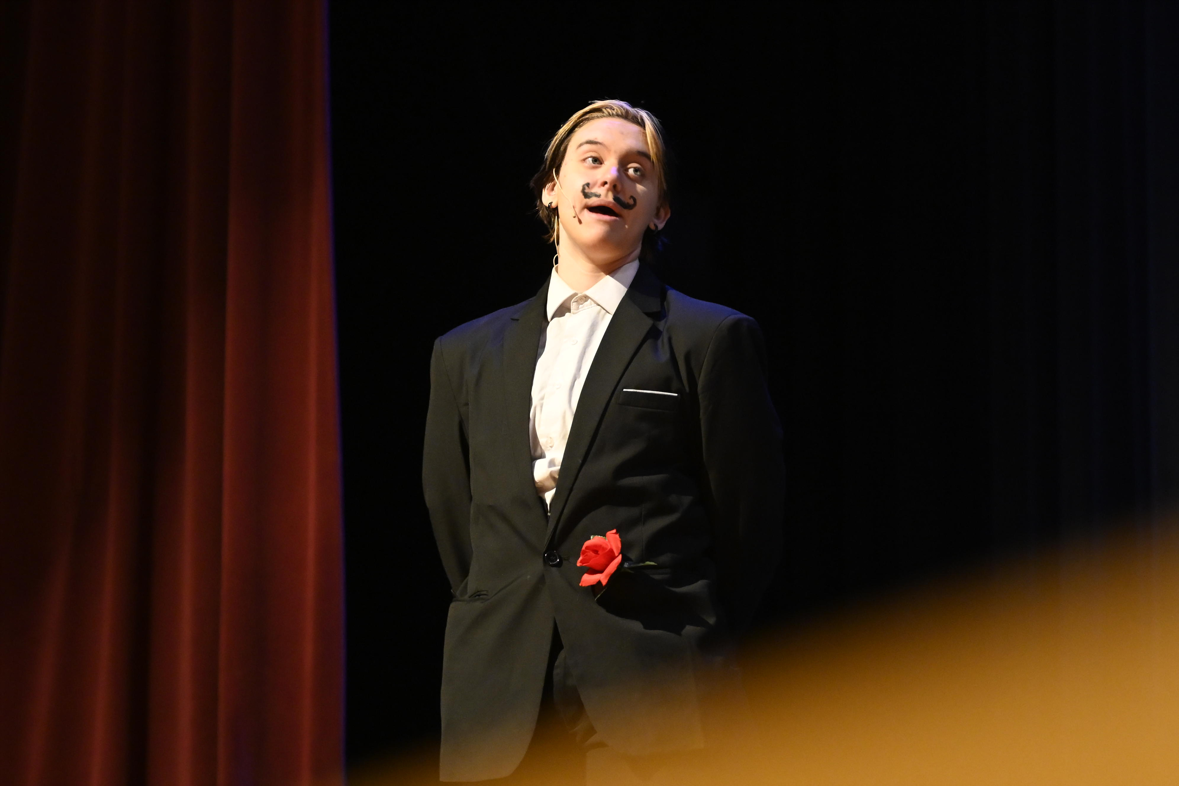 Wadsworth the Butler, played by Oliver Naugle, speaks during a...