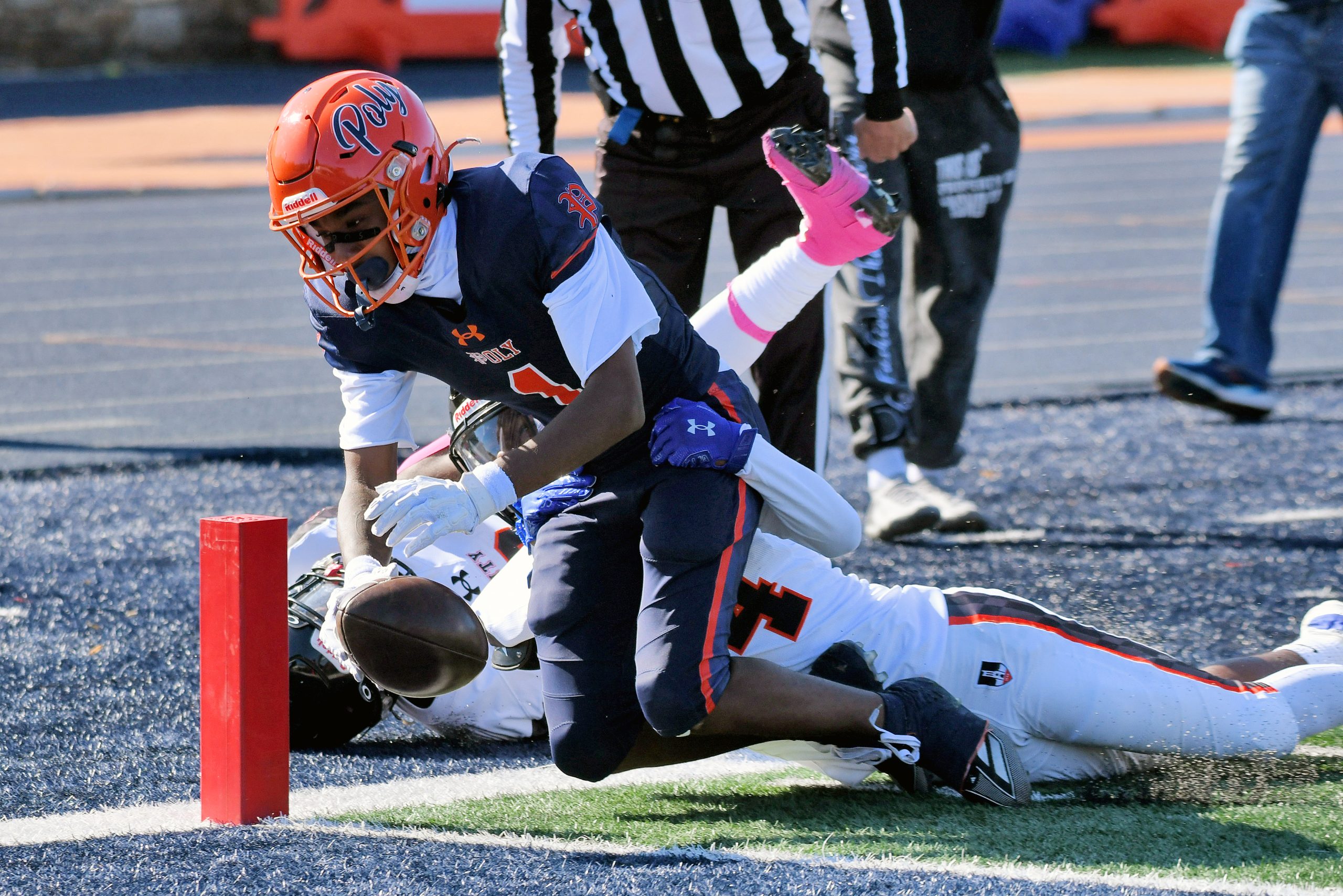 Poly’s Angelo Bond scores under pressure from City’s Kamern Watson...