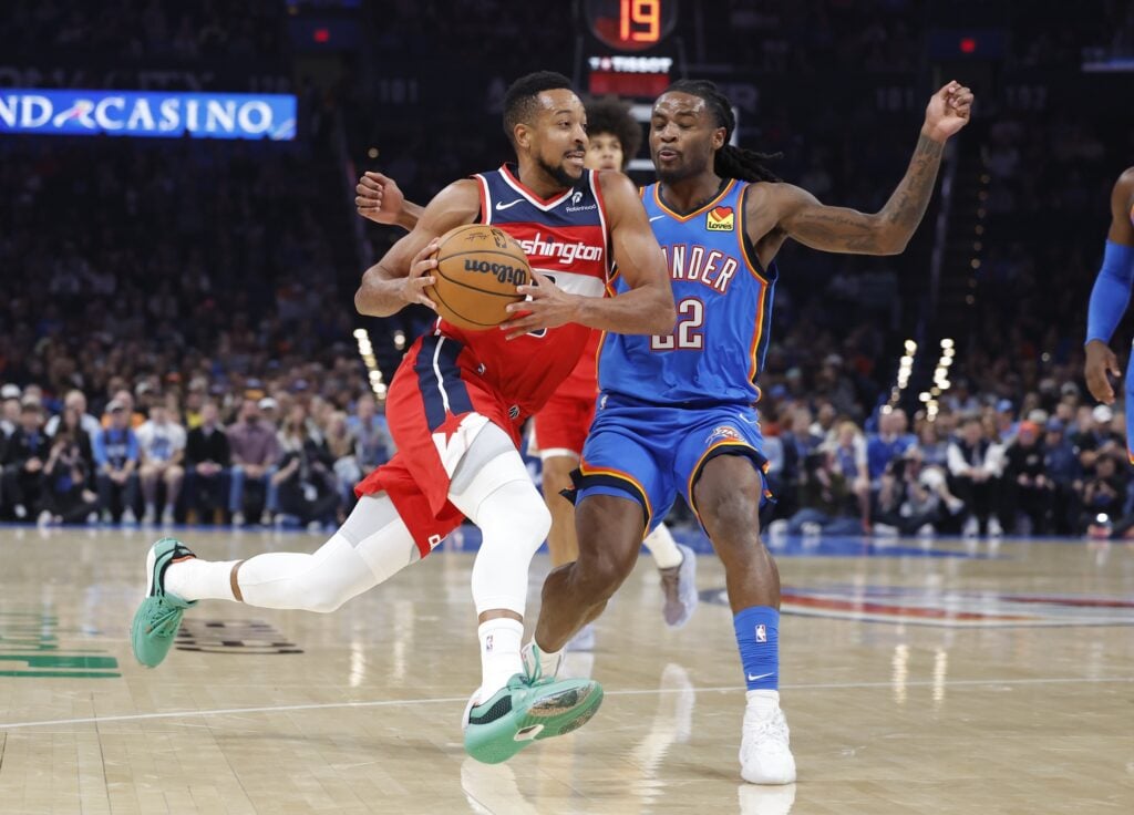 Oct 30, 2025; Oklahoma City, Oklahoma, USA; Washington Wizards guard CJ McCollum (3) drives past Oklahoma City Thunder guard Cason Wallace (22) during the second quarter at Paycom Center. Mandatory Credit: Alonzo Adams-Imagn Images