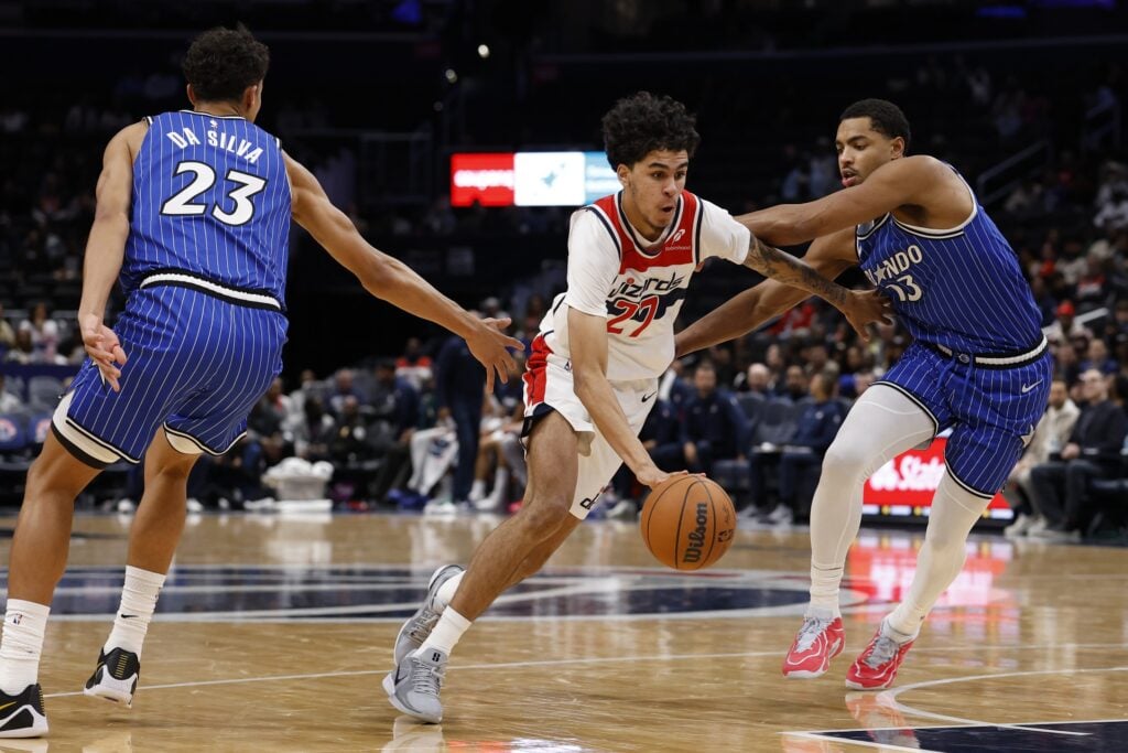 Washington Wizards guard Will Riley (27) drives to the basket as Orlando Magic forward Tristan da Silva (23) and Magic guard Jett Howard (13) defend in the second half at Capital One Arena.