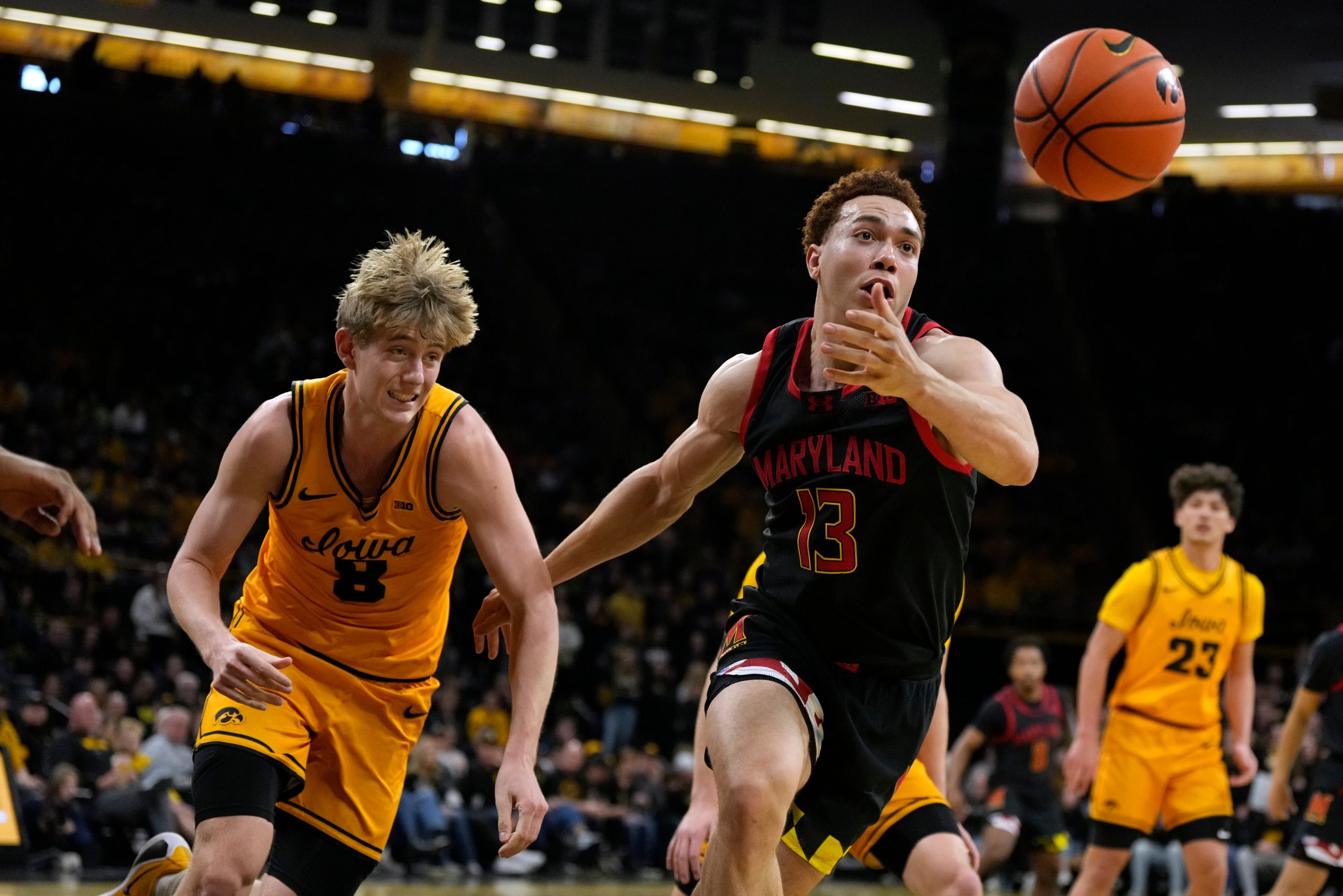 Maryland forward Elijah Saunders (13) runs down a loose ball...
