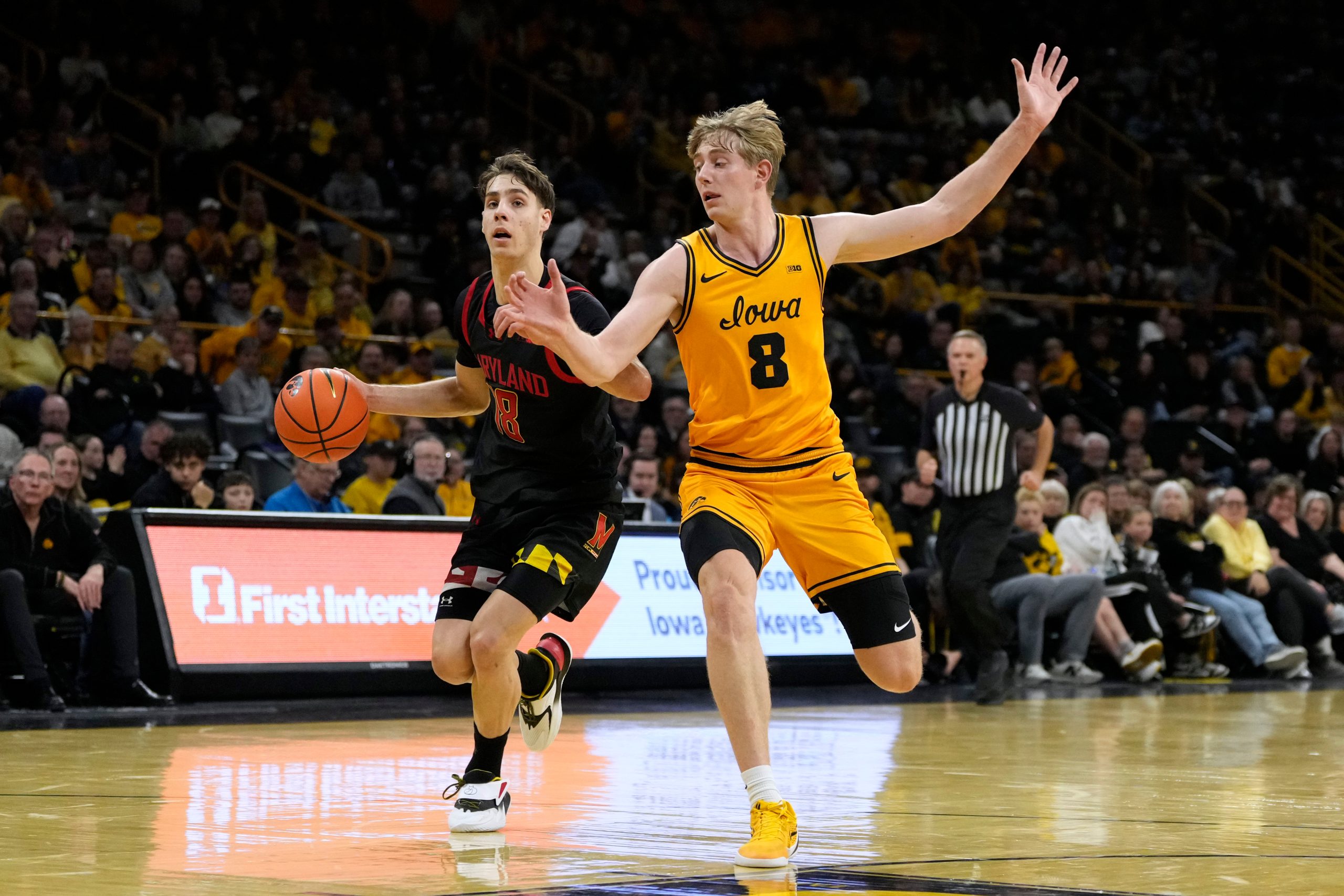 Maryland guard Guillermo del Pino (18) drives up court past...
