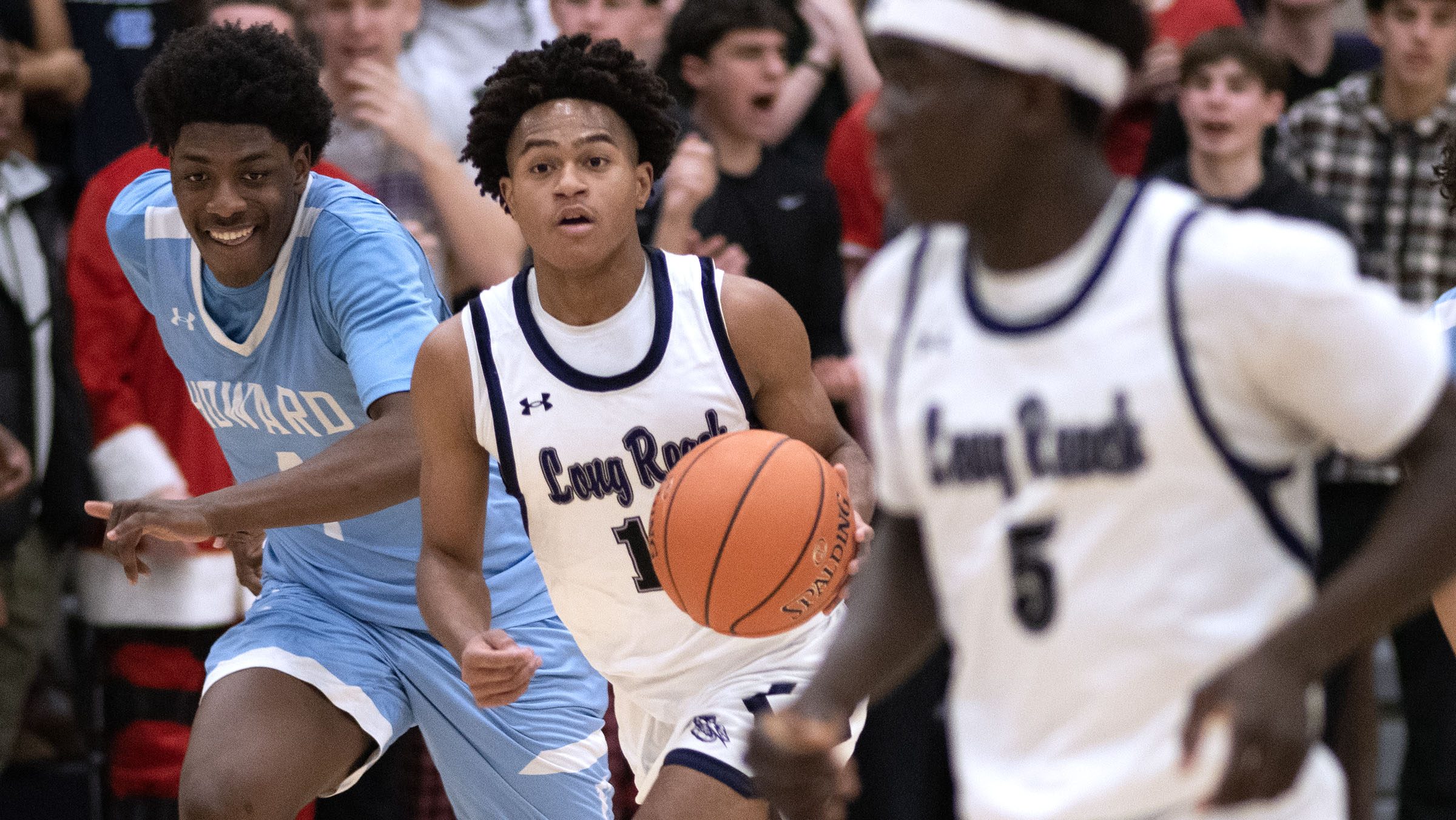 Long Reach's Leon Richardson moves the ball against Howard's Grayson...