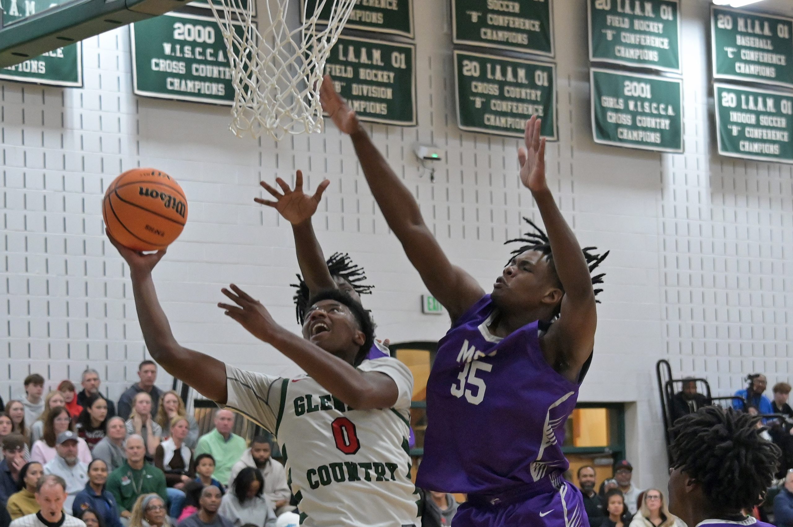 Boys basketball game between Glenelgâs Kayden Leggett Country School and...