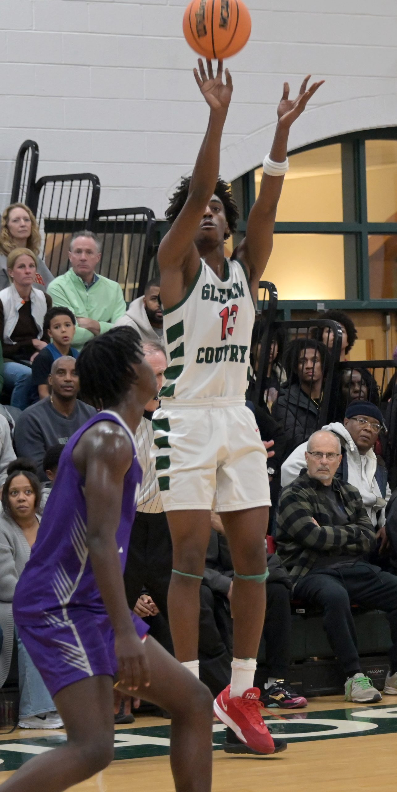 Boys basketball game between Glenelgâs Donovan Marshburn Country School and...