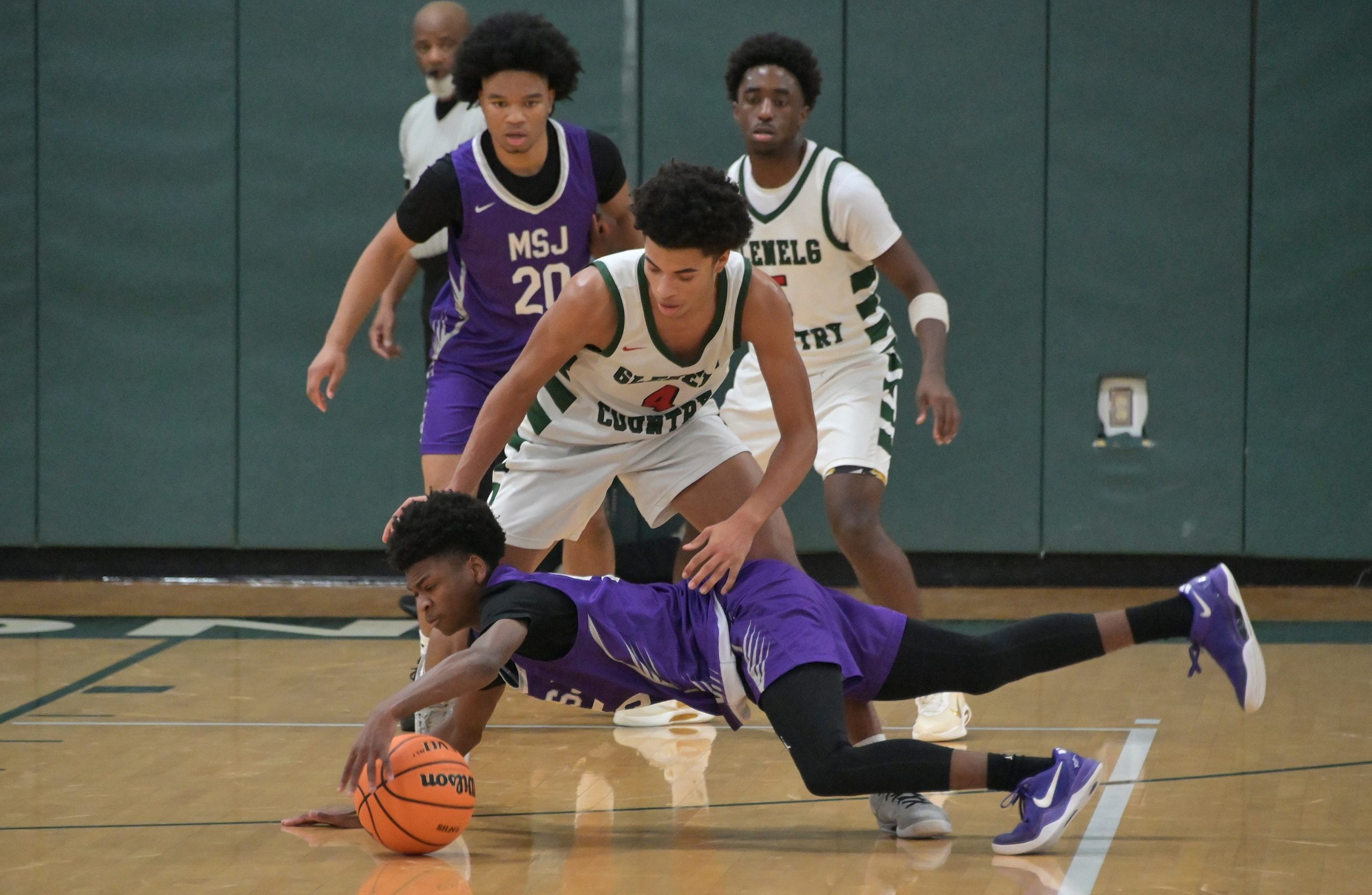 Mount St. Joeâs Chauncey Word dives for a loose ball...