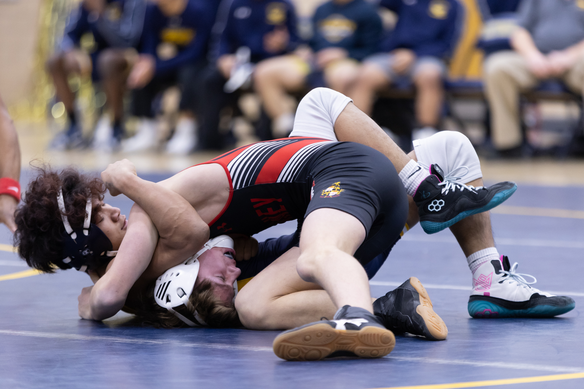 Catonsvilleâs Joseph Khai puts Piper Cantemiry in a hold during...