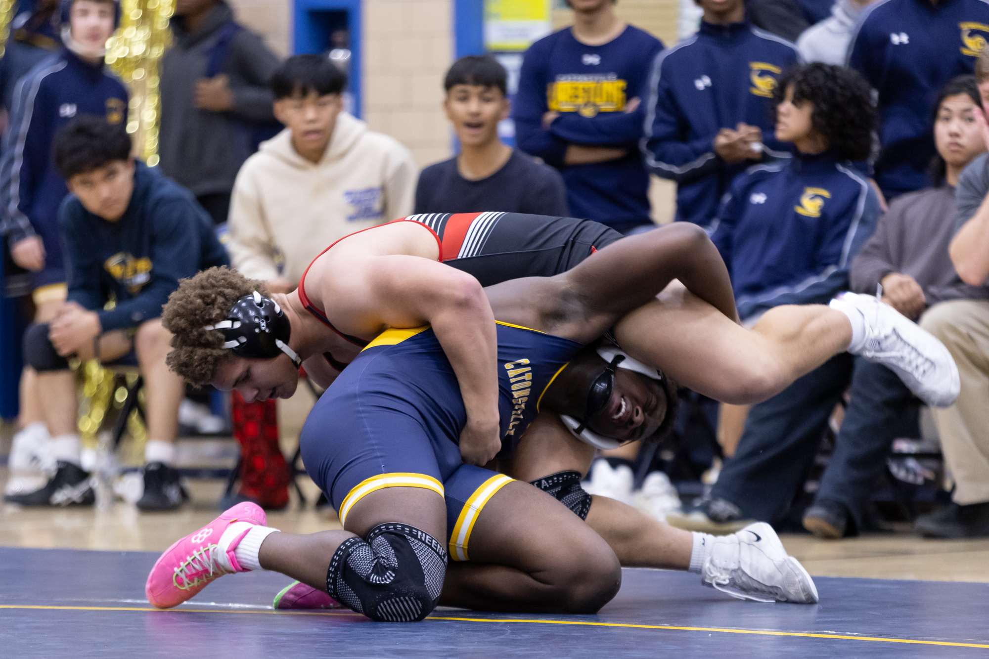 Catonsvilleâs Donovin Boger and Latdior Ceesayand fight for positioning during...