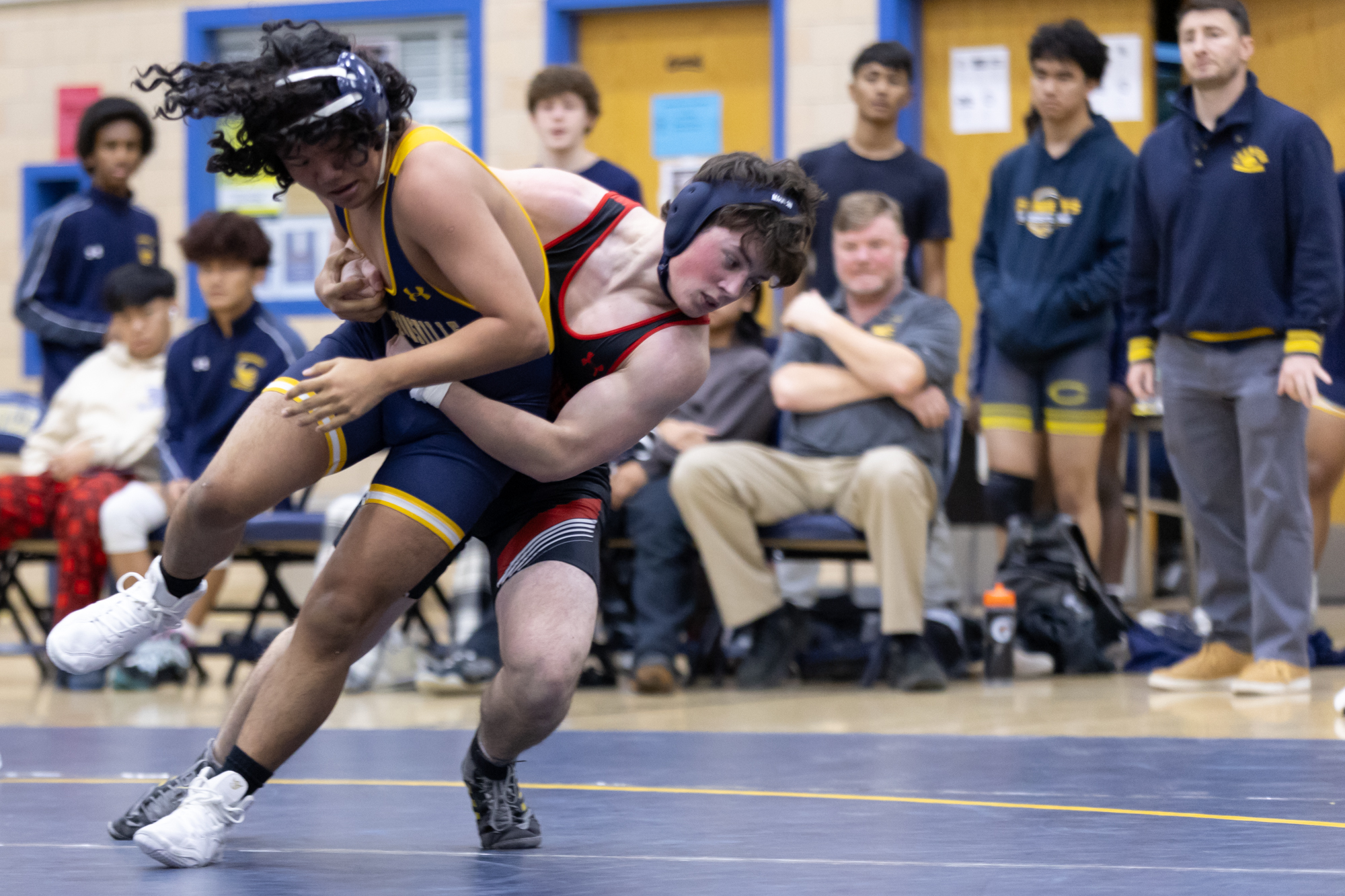 Dulaneyâs Roger Sacks pulls Biehmo Chai to the mat during...