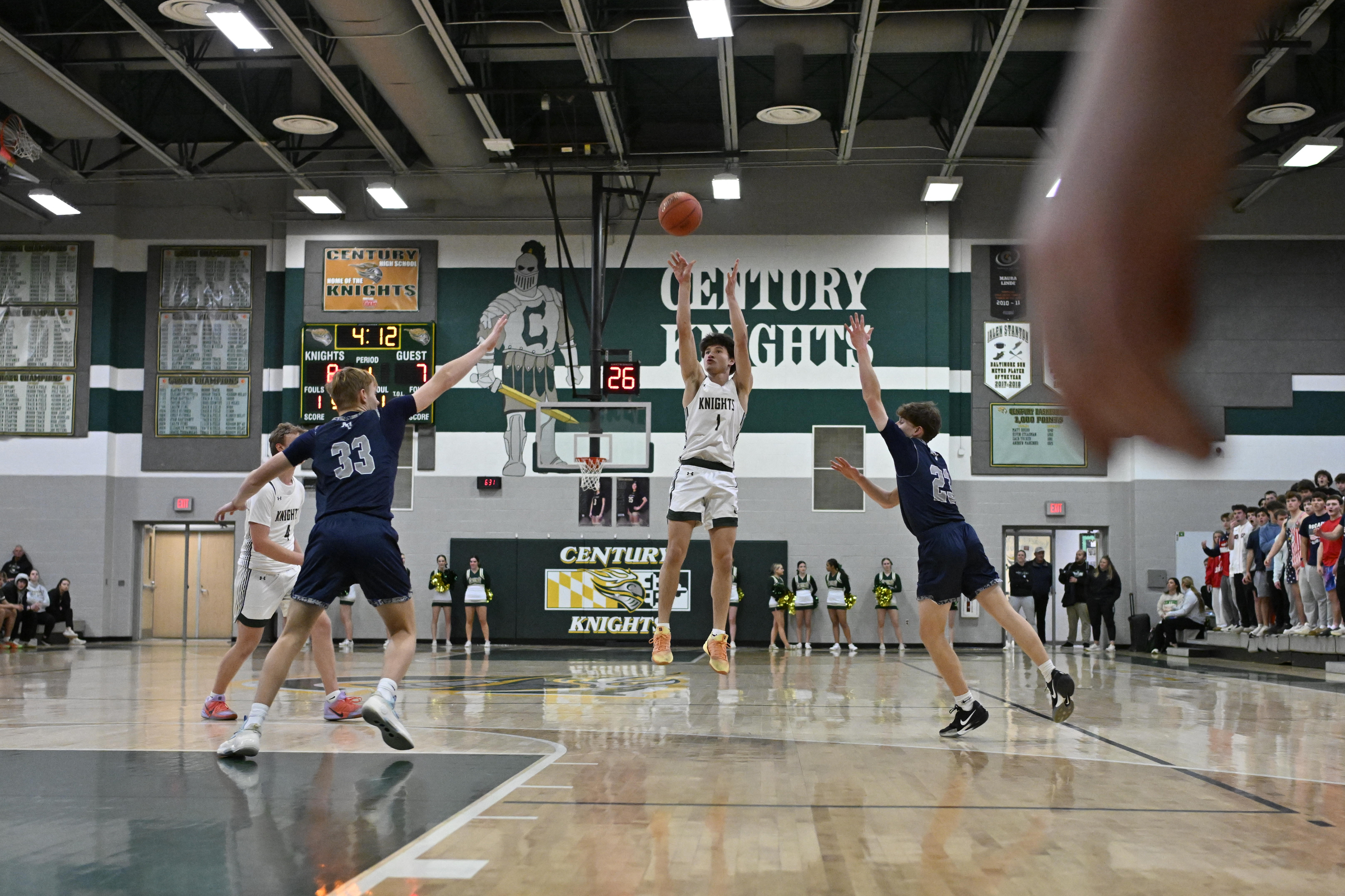 Nate Brown shoots a three-pointer during a basketball game at...