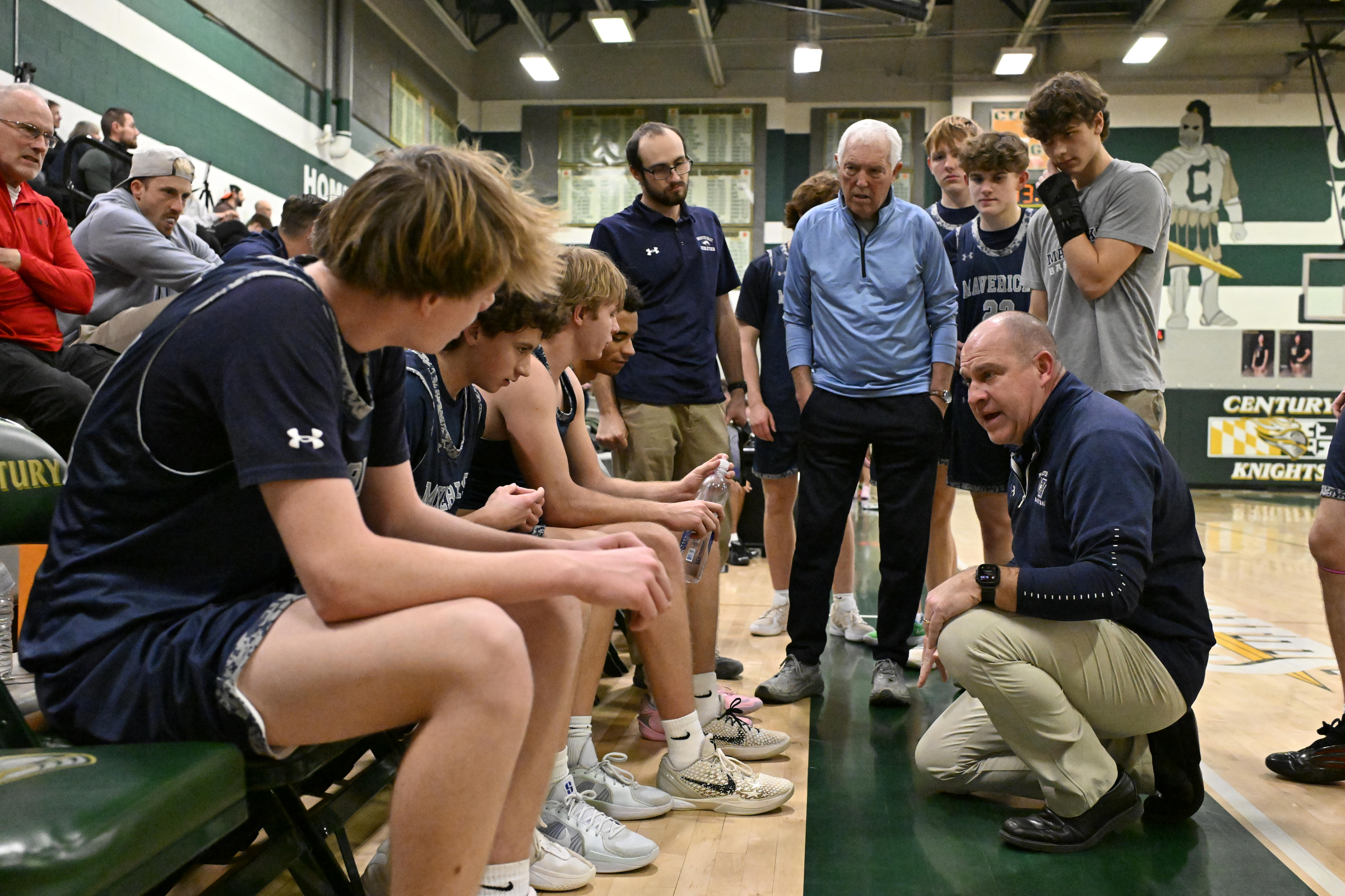Manchester Valley coach Chris Wunder talks with his team during...